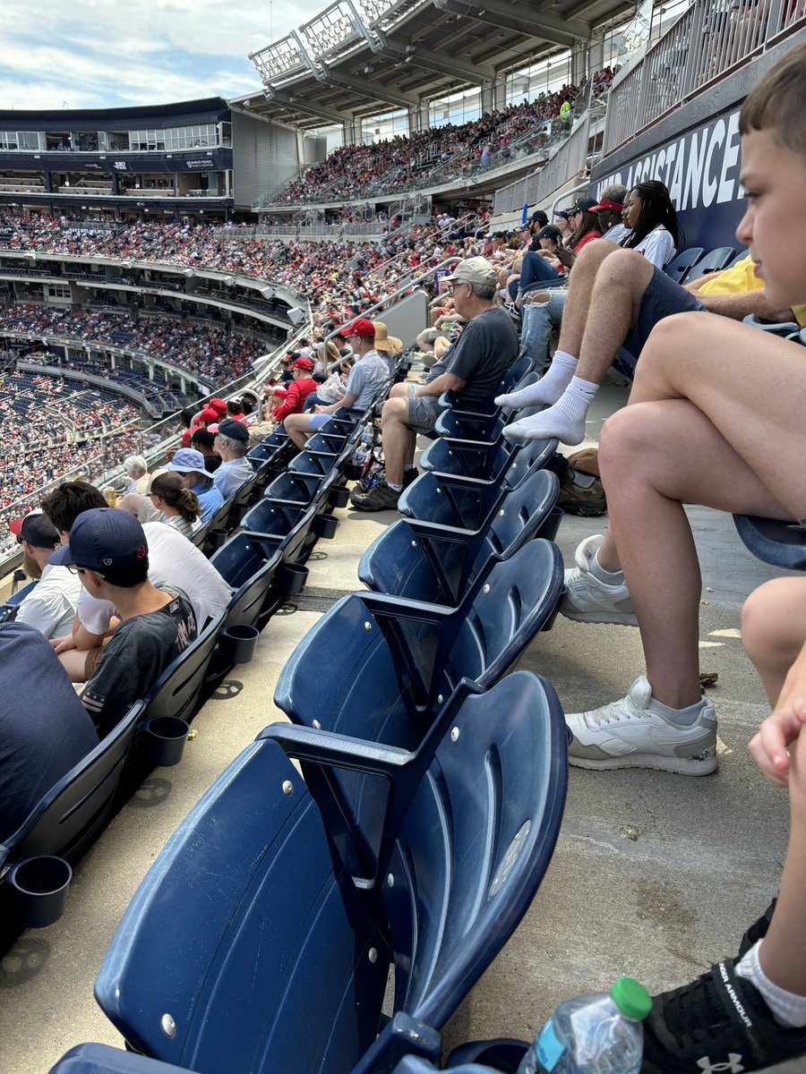 pbowman6's tweet photo. What are we doing? Keep your shoes on. It’s 85 degrees at the nats v Braves and you had to take them off? The tube socks will make you cooler? @MitchMossRadio @paulyhoward https://t.co/8vYwcHIkY3