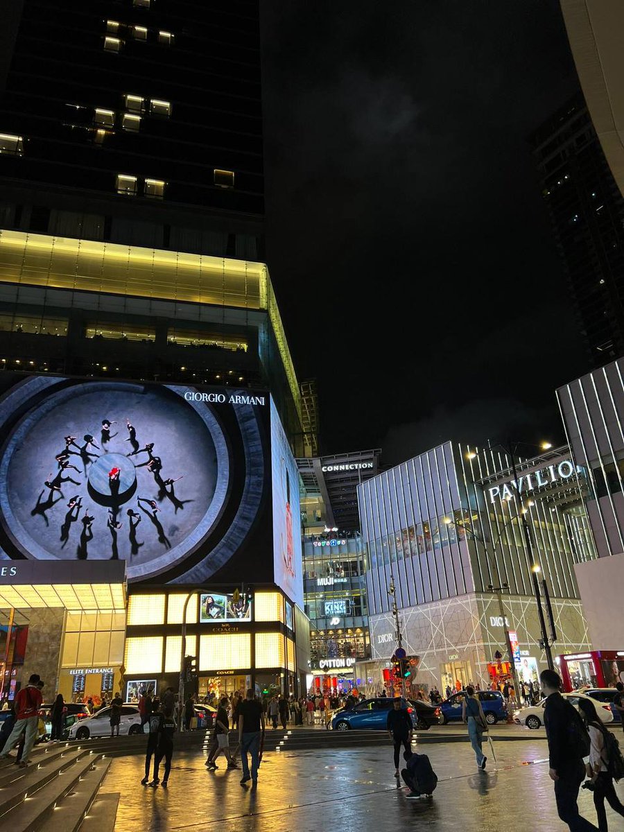 Under the cloak of night, the city's silhouette dances with a thousand whispered secrets.