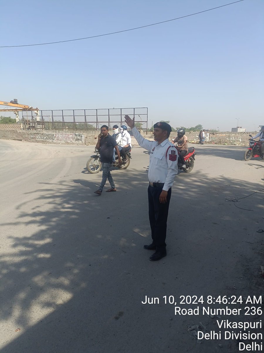 Traffic regulation by staff of Western Range in morning