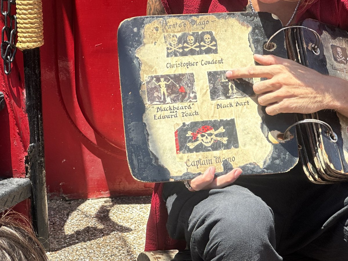 winzigconsults's tweet photo. Kid turned 10 and finally (!!) wanted a bday party. A pirate bday party. We loaded kids up on a “pirate ship” (yay living in a tourist trap). At one point there was a “Know Your Flag” bit. And my kid said, “That’s Stede Bonnet’s flag with Blackbeard!” #ofmd #safespaceship https://t.co/hvfJ5B1Je3