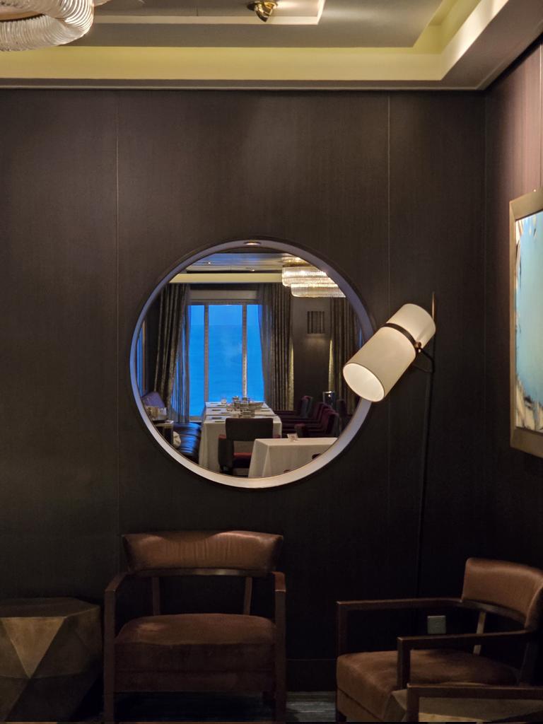 I was drinking my wine when I saw this mirror and thought I had became a vampire.   

When I looked again, a black man was standing there looking back at me and I was pretty sure I had ɓecome a black vampire.