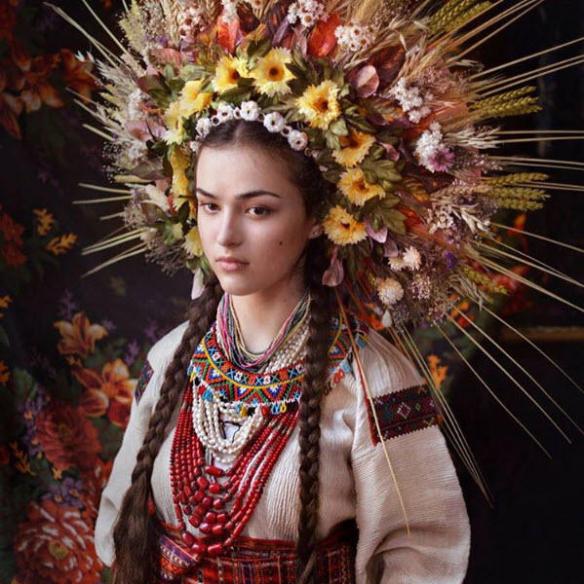 womensart1's tweet photo. The vinok or flower crown is a form of folk regalia traditionally worn by young unmarried women of Ukraine, a symbol connecting to the seasons, fertility, festivals and marriage that has roots in a pre Christian, pagan age. #WomensArt https://t.co/TTWwck7HJU