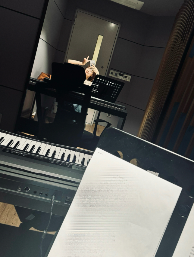 TWICE's Tzuyu shares a new photo from the recording studio, hinting on new music.