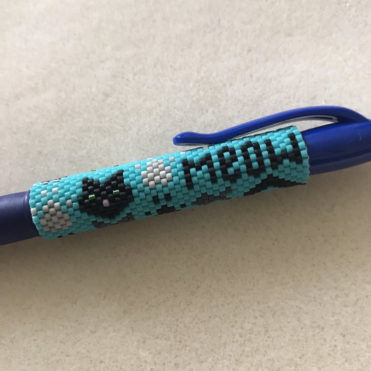 DownlandCrafter's tweet photo. Did you know that today is national ballpoint pen day? That makes it the perfect day to show you my latest hand stitched meow beaded #penwrap. It comes complete with a refillable Pilot G2 pen and is a great gift idea. #beading #beadweaving #cats #downlandcrafters #craftbizparty https://t.co/wNoIlLOseY