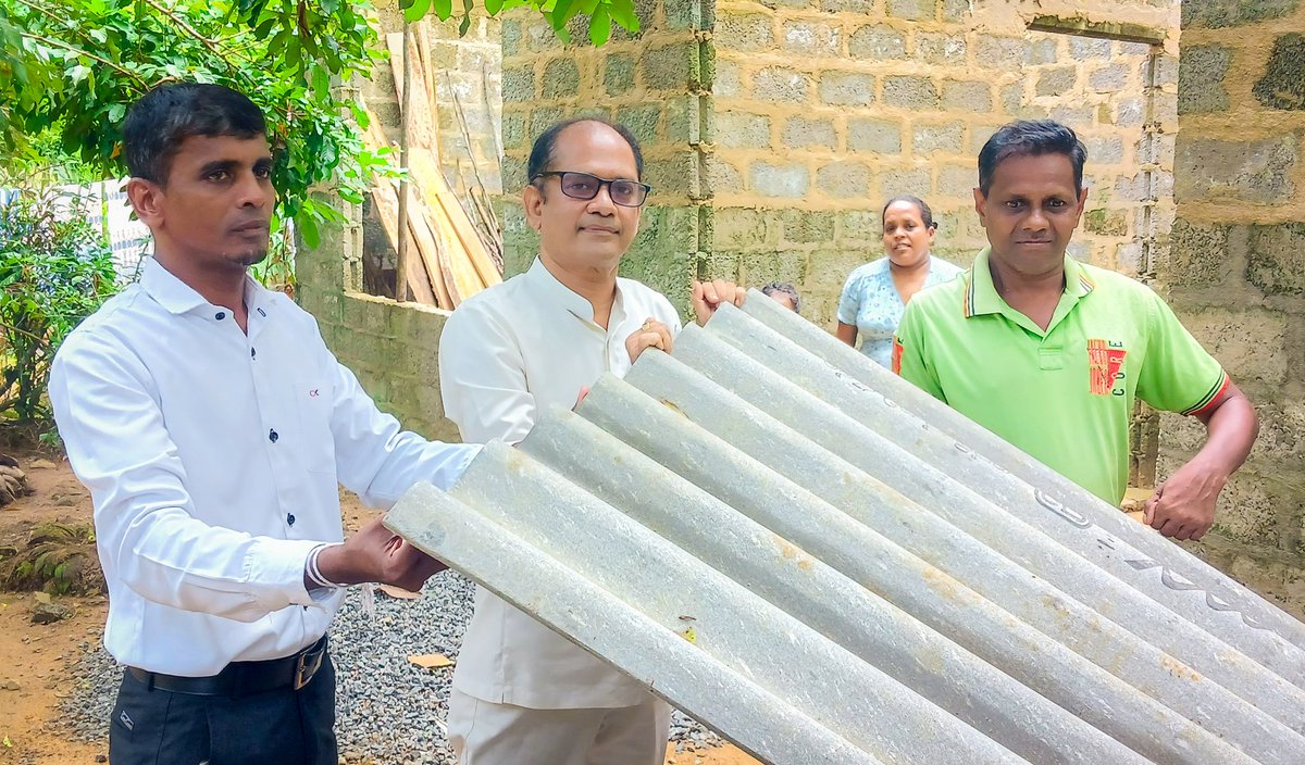 AnupaPasqual's tweet photo. Mr. Piyasiri, a paralyzed carpenter from Matugama Bondupitiya with two school-age children, received materials to complete his house's front roof. Mr. Saman Mudalige, Matugama Region's Coordinating Secretary, joined me in this effort. https://t.co/I0A7hr3lde