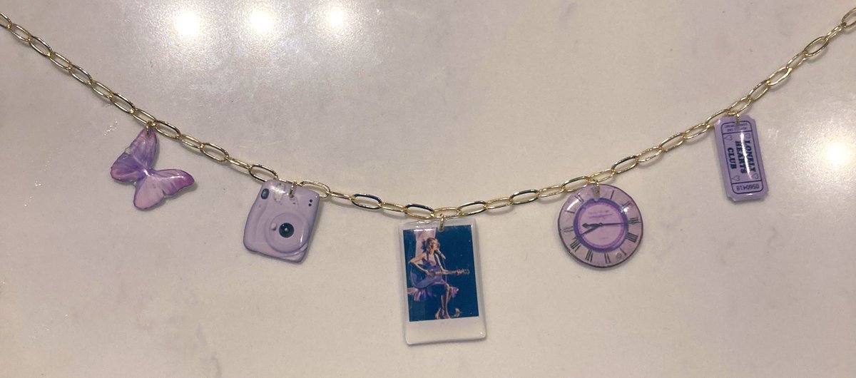 ItsLasagne's tweet photo. Hi #swifties i make these taylor swift themed necklaces for the eras tour and was wondering if this is something people would be interested in buying? here are the tortured poets and speak now versions i made a friend going to liverpool! #TaylorSwift #ts #erastour https://t.co/o4P005Rbls