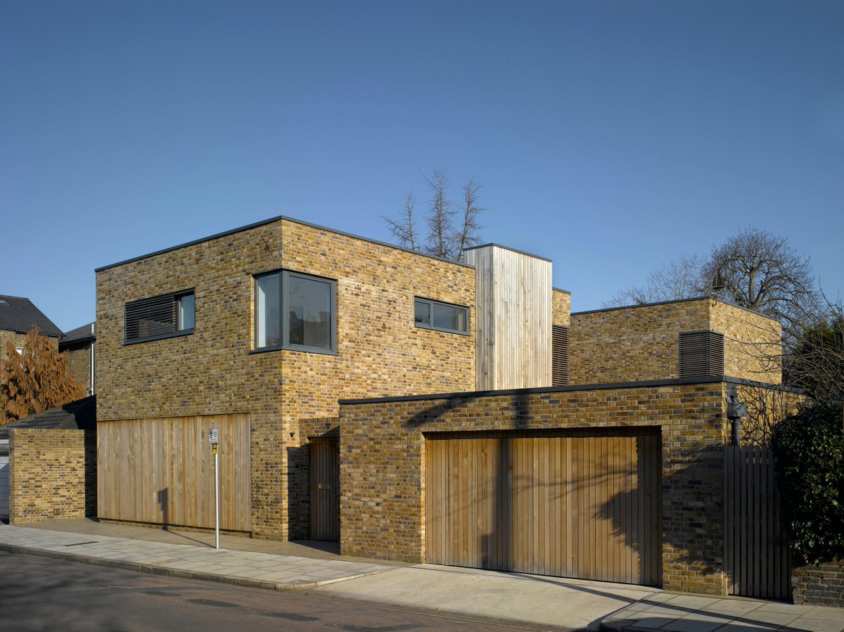 Surrounded by Victorian homes, the frontage of this residential project in London blends with the existing garden wall. The main focus was on a building that looks inward, utilizing light from above and inner courtyards. #residentialproperty #urbandesign #urbanvibes
