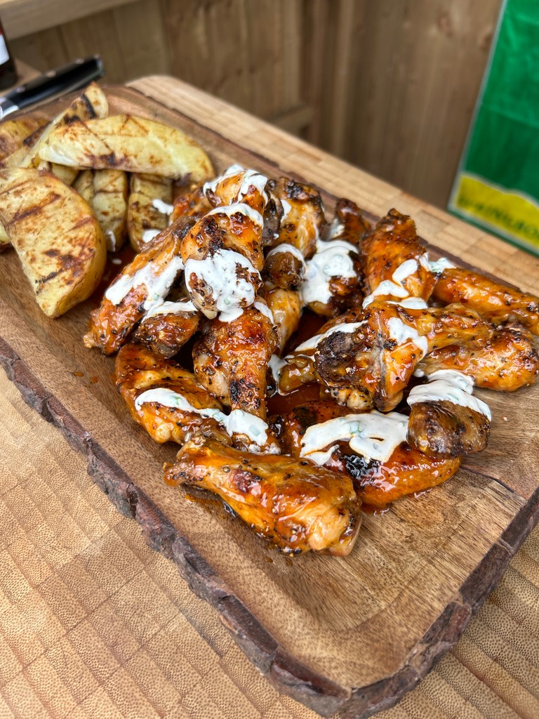 braai_lad_uk's tweet image. Oh, you mean those little flappers of deliciousness? 🍗🔥 Can't beat the crispy skin and juicy meat of chicken wings on the braai! #BBQheaven #WinginIt #GrillMasterInTheMaking