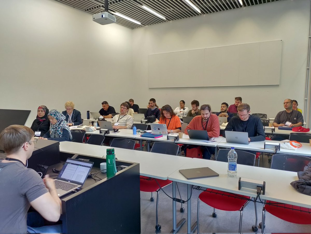 People working hard and <a href="/OliverKarras/">Oliver Karras</a> being a good teacher