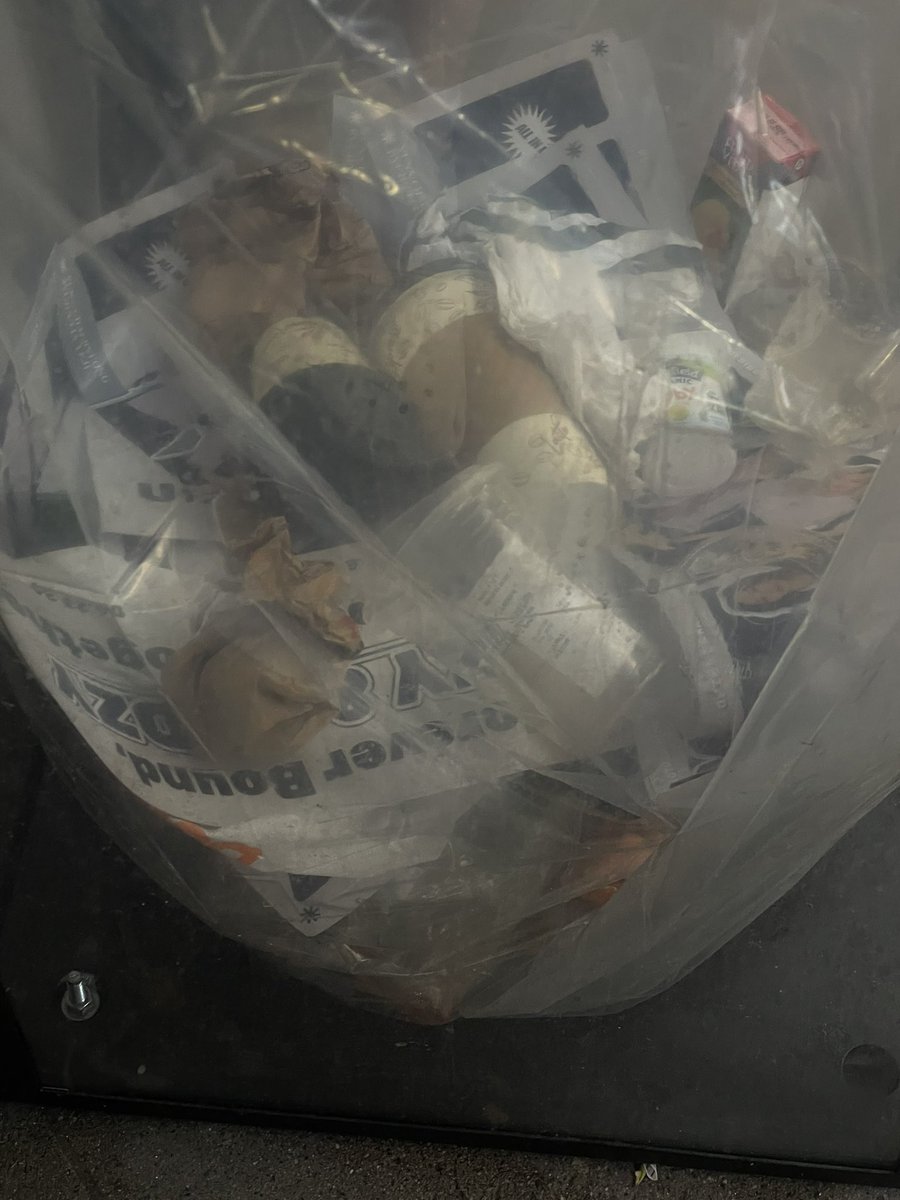 people throwing their banners away at the train station 😔