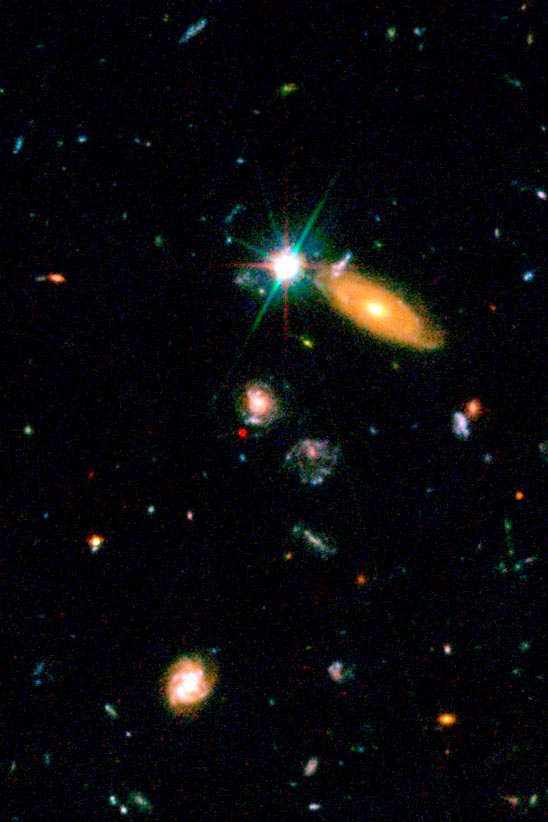 Can you spot the supernova?

Hint: At the center of this image, the red dot shows a star's explosive death.

Hubble's Advanced Camera for Surveys examined this distant supernova – 8 billion light-years away! – to learn more about our early universe: go.nasa.gov/45C0Aum