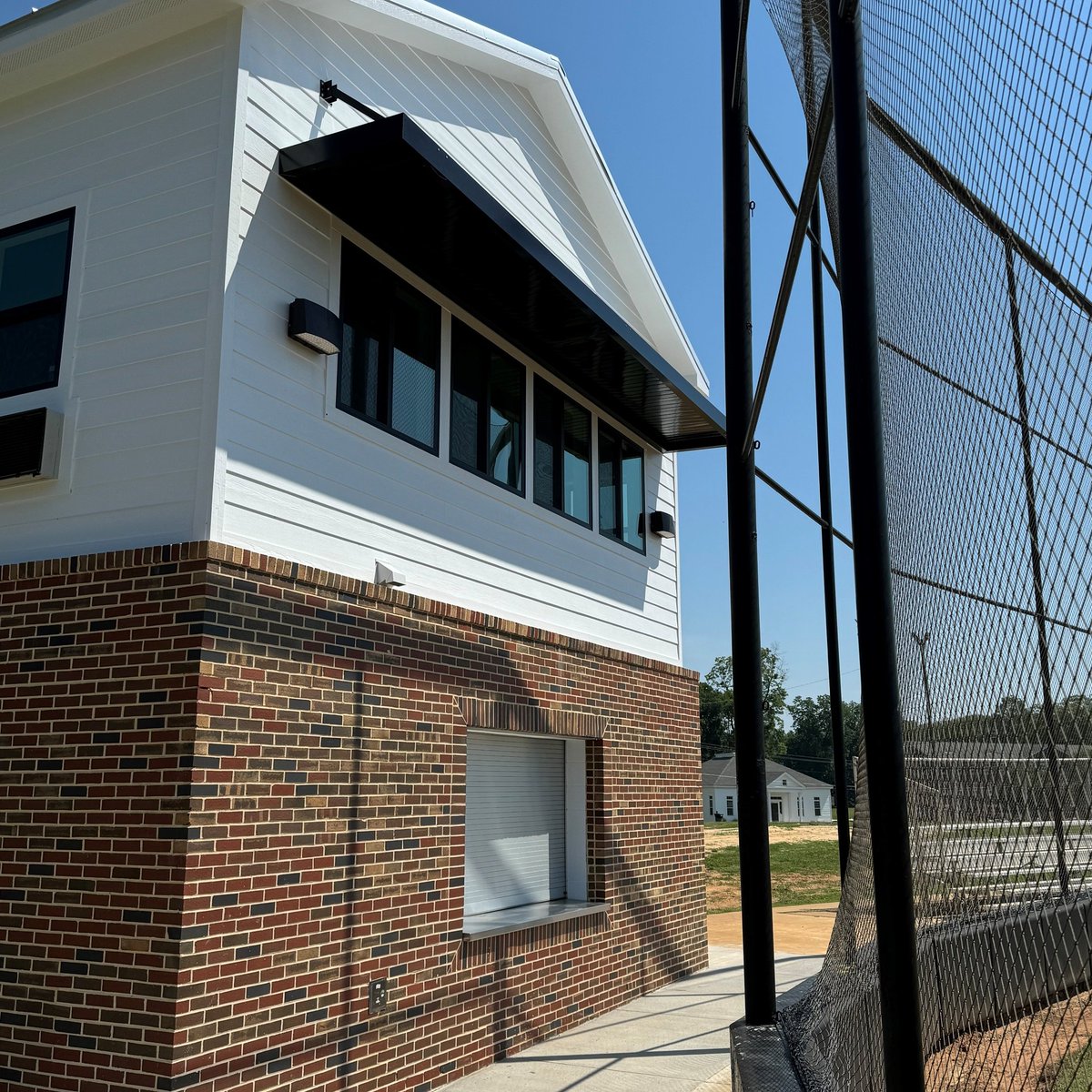 MarionMilitary's tweet photo. The @Mmitigerssoftba new🥎Press Box is now complete, thanks to a generous donation from Dr. George M. Rapier III (MMI '69).  Features: concession stand, restrooms, coaches offices, storage + elevated view for game management/broadcasting. We're ready for fall ball! #mmitigers https://t.co/H8I1cVNTSm