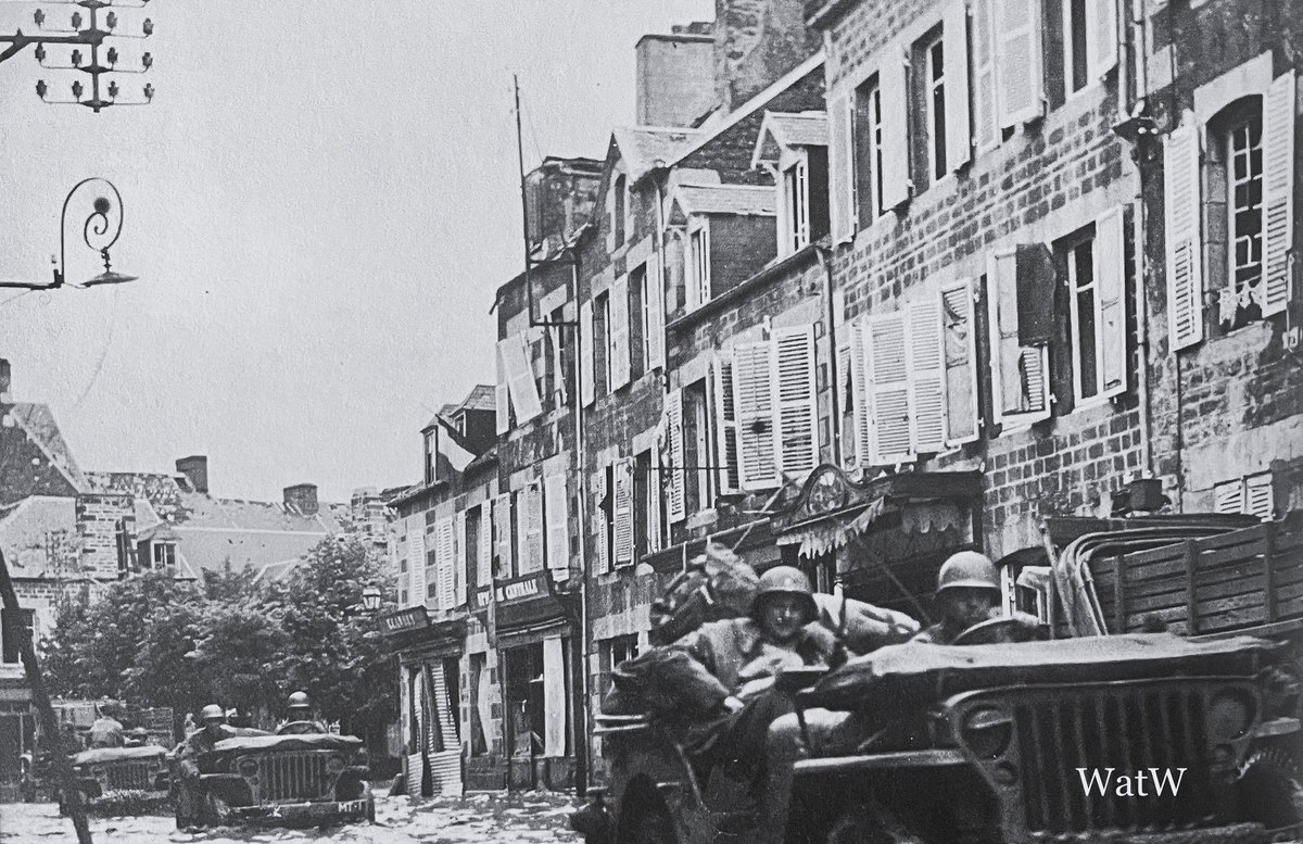 TheWorldatWar2's tweet photo. US soldiers find themselves axel deep in water after the river Vire burst its banks - St Lo, France, July 1944 #rivervire #stlo #normandy #france https://t.co/UEeocWspek