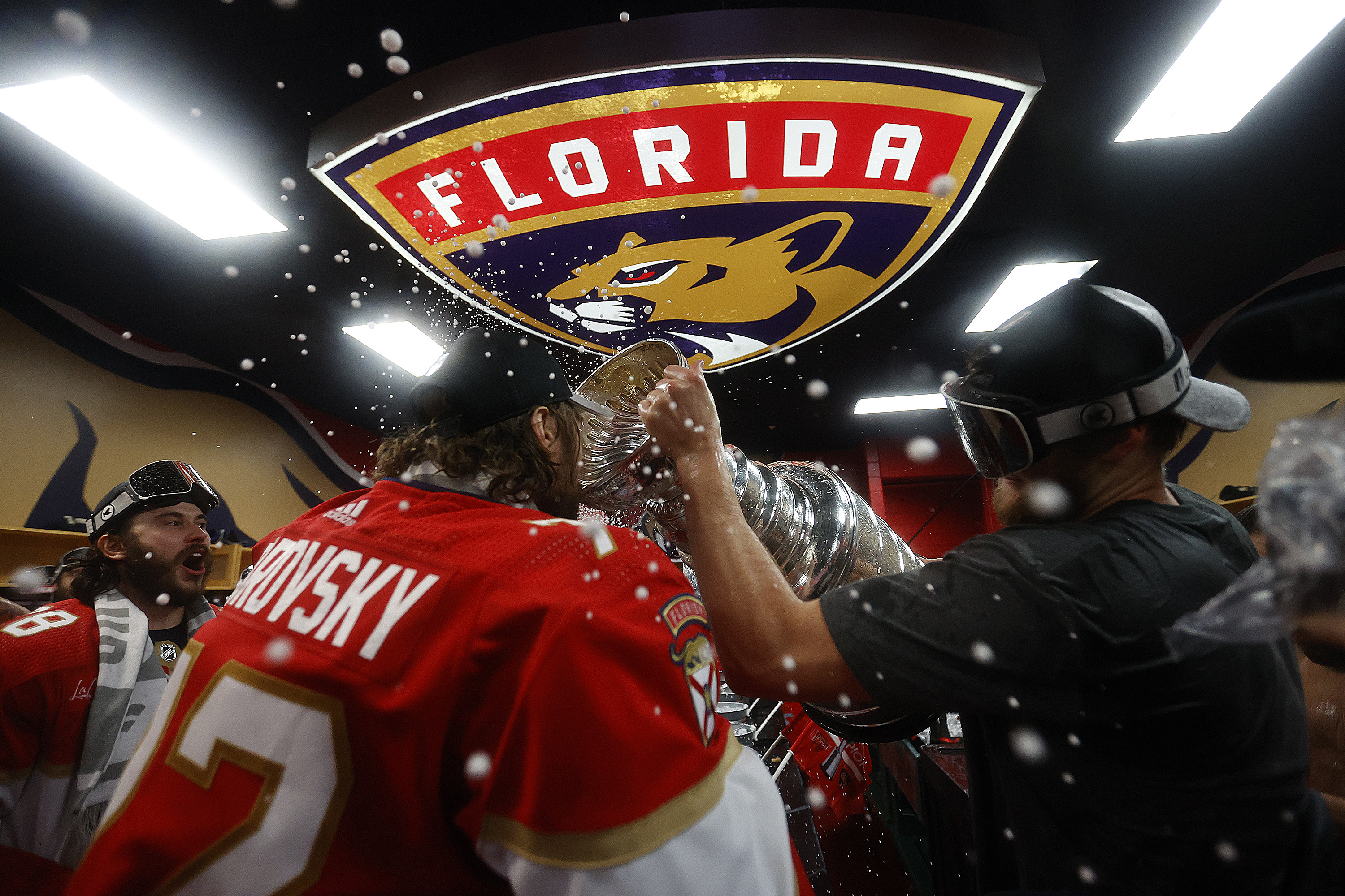 Sergei Bobrovsky drinking out of the Stanley Cup. 