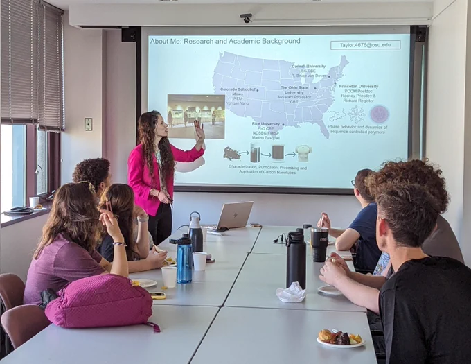Dr. L. Taylor delivers a breakfast workshop on 'Communicating Science'
