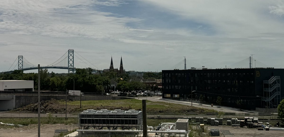 Thinking about <a href="/newindustrials/">New American Industrial Alliance</a> #Reindustrialization at an event set with the backdrop of the Ambassador Bridge in the foreground (25% of US trade with Canada!) and the new Gordie Howe bridge in the background (that was connected just 2 weeks ago!). U-S-A (&amp; Canada)!