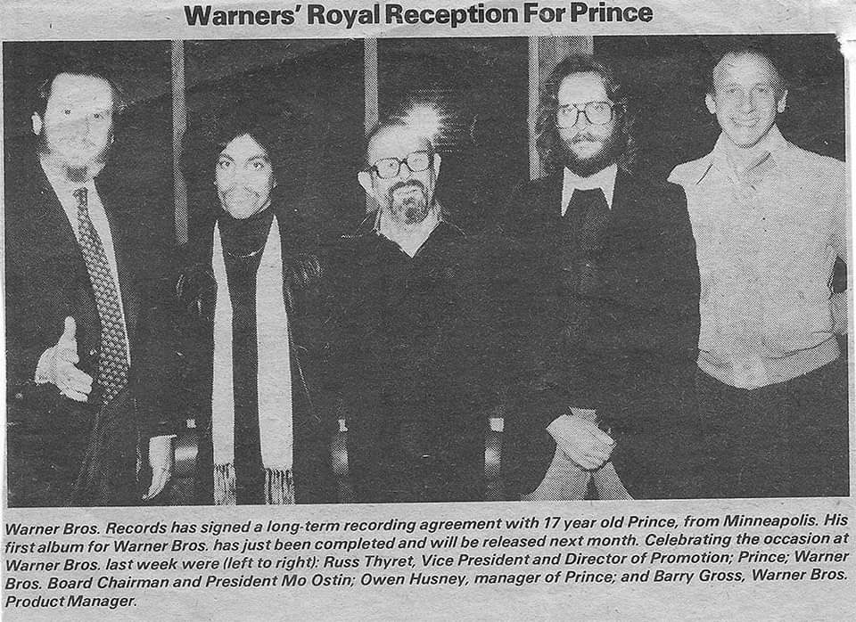 drfunkenberry's tweet photo. Not ONLY was "Purple Rain" released on this day in 1984, @prince signed his recording contract with @warnerrecords fka WBR on June 25th, 1977. Here is the photo from the trades with the announcement. Pictured is the late Mo Ostin, PRN, Owen Husney, & Barry Gross. As U see, they say PRINCE was 17 when he signed. They shaved TWO years off his age as he was actually 19.  #PRINCE #PRINCE4EVER