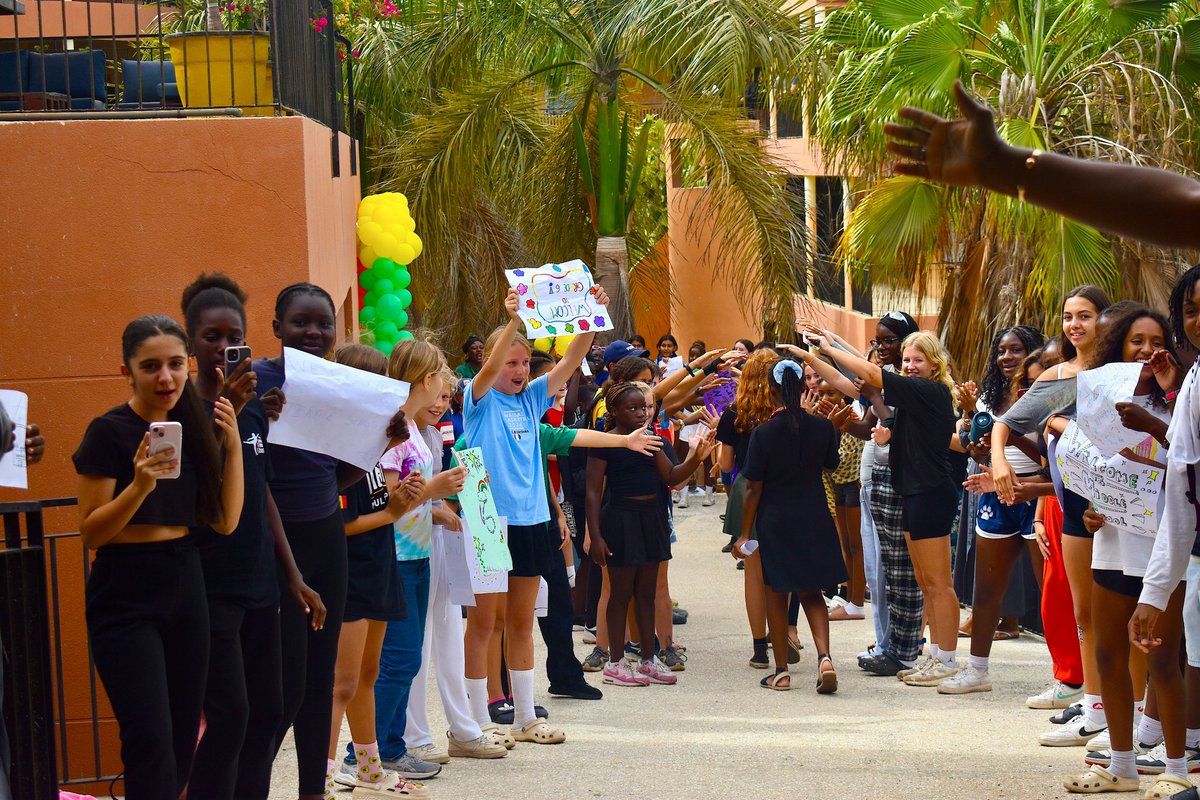 ISDakar's tweet photo. The transition from elementary into middle school is a remarkable and momentous occasion, and our community came together to cheer on our 5th graders as they were welcomed into the secondary school community. #ISDakar #Grade5 #Elementary #MiddleSchool https://t.co/aG66HQCkBk