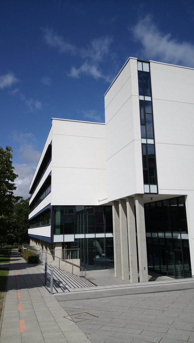 Admiring the sharp lines and geometric shapes of the New Science (NEWSCI) building against the bright blue sky at <a href="/uniofeastanglia/">UEA</a> #Norwich #Architecture