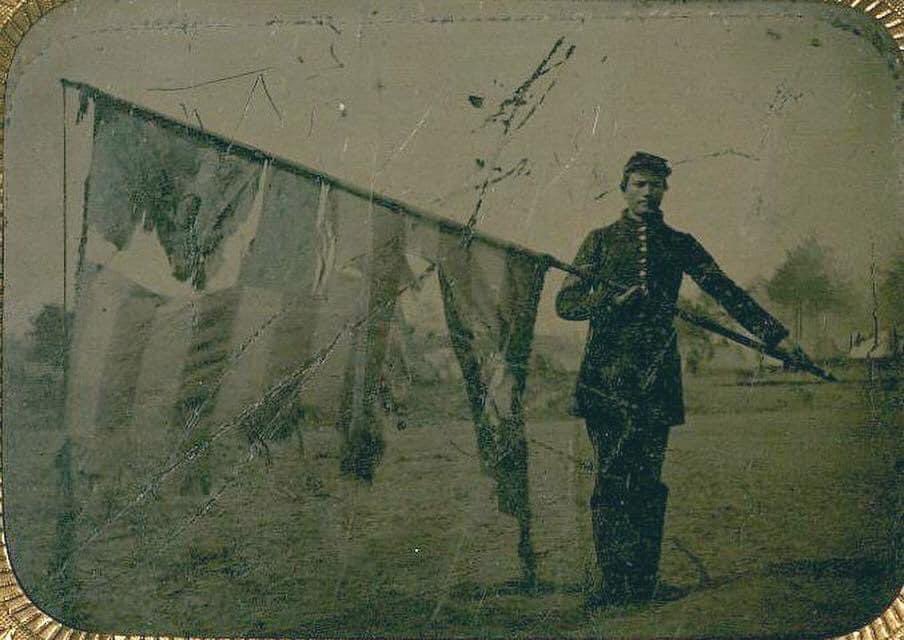 civilwarpgh's tweet photo. On this Flag Day we remember Sgt. Alex Rogers, who is seen here holding the colors of the 83rd Pennsylvania Infantry. Rogers carried the regiment's flag through several engagements, including Gettysburg in July 1863, until his death at the Battle of the Wilderness on May 5, 1864. https://t.co/11YPsKI4JX
