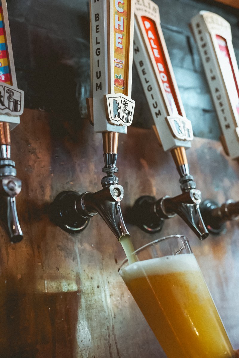 Pouring a perfect pint of our refreshing Peach Beer called the "Peche"! 

This Texas fruit beer is a delightful blend of Belgian-style wheat beer and 100% real peach juice, boasting a 4.9% ABV. 

With its golden color and aromatic notes of juicy peaches grown right here in Texas,