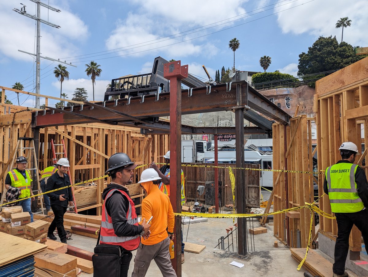 lahmonarch's tweet photo. Concrete work for the basement and podium is nearing completion at 3004 Sunset in Silverlake. The construction crew is now framing the wood above the podium and installing steel for the entrance that leads to the courtyard and community room. https://t.co/xuO6YrqdE5