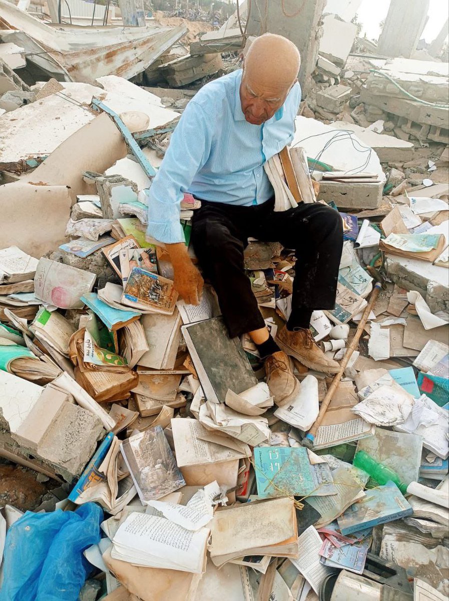 The writer Fayez Abu Shamala, amidst the rubble of his house targeted by Israel in Khan Younis, is trying to salvage whatever books he can gather.