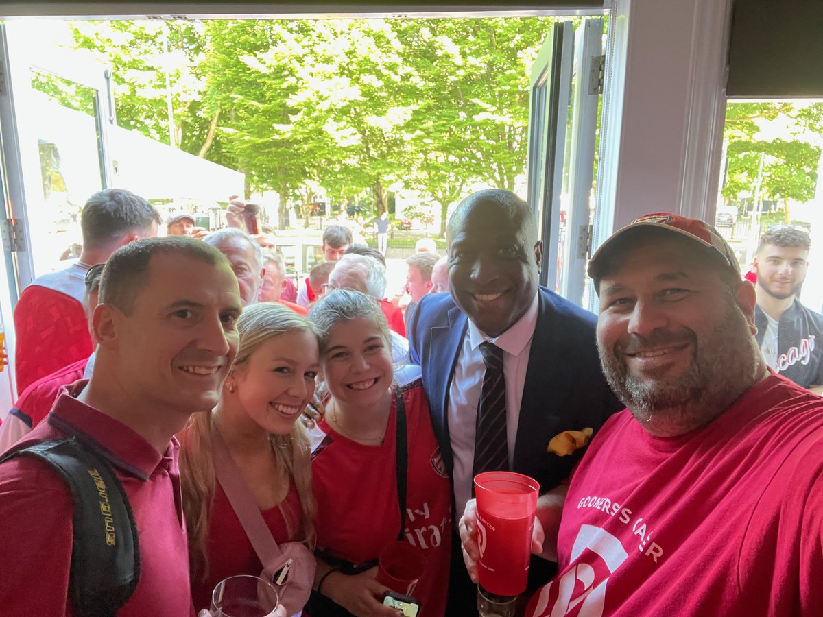 TheGoonersPod's tweet photo. VERY LONG tweet but I hope you'll take the time to read it. 

Kevin Joseph Campbell has passed away, at the cruelly young age of 54. While it is an inevitable fact that all people – whether family members, friends, strangers, sporting or show business idols, everyone – eventually meet this fate, this is the hardest to grasp, the most confusing to make sense of, as to why something so awful could happen to someone so purely and completely wonderful. While I cannot stop from happening what has happened, none of us can – I would like to share with you some of the multitude of reasons why “Super” Kev was “Super” – and the absolute best of all of us. The fact that so many people reading this will already have known why Kevin was “Super” is testament to the man’s greatness.

I first laid eyes on Kevin Campbell in text form. It was 1988 and I, as a 15 year old American finding myself in London for two years as my stepfather’s job brought us there, somehow ended up regularly on the North Bank Terraces of Highbury, 90 minutes before kickoff (to make sure to get my spot) armed with a pint of scotch, a diet coke to chase it with, and an Arsenal game programme to help pass the time. It was in that game programme that I would see Kevin’s name – in the “Reserves and Youth” section. I noticed that he was virtually always listed amongst the scorers and heroes of the squad, to the point where it became a regular tradition for me to open the programme and go directly to that page to see how many goals Kevin had scored since the last programme was out. He became this mythical creature, this young man who clearly was becoming too good for that level, but would face stiff competition from Smith, Merson, Marwood, Groves in the senior team’s attacking force. I wondered when I would see him on the pitch at Highbury, and whether his youth form would replicate on the biggest of stages.

What I didn’t know at the time was that he was very much on the fringes – spending time and travelling with the first team before (and after) going to Leyton Orient on a loan spell where his form in front of goal (9 in 16 games) made him a hero and carried that team to promotion to the third tier. Thankfully, George Graham rebuffed Orient’s understandable attempts to sign him permanently – he was far too good for third tier. Kevin made it back to Arsenal from loan in time to be with the club for its crowning moment – 26 May 1989 at Anfield.

Fast forward to 7 March 1990, a home match against Nottingham Forest. After returning from a half-season loan to Leicester City, Kevin was (finally!) brought off the bench as a second half sub, replacing Merse. It doesn’t take a genius to figure out that Kev put the ball in the back of the North Bank net that day – finishing off a 3-0 win. I will never forget that moment – even 34 years later – because it was so anticipated to see him and he delivered, taking a nifty flick from Smudge, driving towards goal and cooly finishing to the far post. Who was the first person he celebrated with? A high-five to the steward standing on the west side of the North Bank. This was not an inconsequential moment, as it may have been the first of many times that Kevin, now a senior professional superstar, would share special moments with “ordinary” people.

Kevin’s footballing career took him to some amazing places – holding FA Youth Cup, First Division, FA Cup, League Cup, and European Trophies in his time in North London, moving to Nottingham Forest where he played a major part in their promotion to the Premier League in 1998, then to Turkey for a brief spell with Trabzonspor where he ultimately left the club in protest over his teammates not being paid (as well as some other unpleasantness with club leadership). Eventually he arrived at Everton in March of 1999, where he immediately (and virtually singlehandedly) kept Everton from relegation by scoring goals in bunches from the off and eventually became Everton Football Club’s first black captain. His final stops were West Brom (where once again he helped save the club from relegation with his goals) and Cardiff City, where his brilliant 20 year senior career came to an end.

So that’s Kevin Campbell the footballer –a prolific footballer with a knack for scoring massive goals at vital times, assisting in the winning of trophies, the avoidance of relegation, and promotions for virtually every team he was part of. But even more – a beloved teammate, a leader, a virtuous man who soaked up every bit of deserved adulation and praise from those who supported the clubs for which he played. 
 If that were the extent to which I knew Kevin Campbell, I would be very sad today over the loss of a great footballer. Sadly today, but truly fortunately, that is not the extent to which I (and so, so many people) knew Kevin Campbell.
Fast forward again to 11 March, 2018. It is a day that I have long called my favourite day as a Gooner despite it not lining up with any massive footballing outcomes. I once again found myself in North London, visiting and taking in my beloved Arsenal against Watford. The day began in a pub sharing drinks, stories, and laughs with a friend and another truly great (and sadly departed) man, David Faber aka “Goonerholic.” It was always wonderful to start these days connecting with a bridge to Arsenal’s past, and I valued those conversations greatly. From there it was off to the game to meet up with more of the great new friends I’d made in recent years. Would you even believe that in this 3-0 win, we saw the absolute rarest of footballing feats – a Petr Cech penalty save against Troy Deeney!

On a high from watching a pleasurable Arsenal performance, we flocked to the Twelve Pins for our usual postgame drinks and to revel in our victory. One of our friends, Lee, was missing – but I got a text from him that he had a surprise for us. 5 minutes later, out of the corner of my eye, I see Lee bouncing towards the pub with a special friend in tow – none other than Super Kevin Campbell. By that time, I had been lucky enough to have Kevin as a guest on our podcast, but never envisioned I’d ever have the opportunity to meet him in person. Dressed impeccably (as always), wearing a red shirt with black jacket and black cap, he rolled into the outdoor patio of the pub and immediately started singing Arsenal chants with the dozen or so of us who were gleefully jumping up and down with him.

Kevin took time to personally greet everyone, shook hands, gave out hugs, bought pints and accepted pints bought for him, and just “hung” with us for hours. It wasn’t an “appearance” or a token gesture, he was truly being a fan, a fellow supporter gleeful at our win on the day, an equal, a Gooner. I of course was giddy and the full circle of it all, exactly 28 years to the week that I watched him score his first goal for The Arsenal. We facetimed my mate Andy who was in Colorado to wish him a happy birthday and taunt him for missing out on this epic event. The evening got fuzzy after a while, but I woke up the next morning (on my 45th birthday) with a smile on my face from a truly epic evening meeting one of the heroes of my Arsenal youth and celebrating together like mates.

Those scenes would be repeated several times over the following 6 years. At pubs before and after Arsenal games on occasion. On podcasts where he occasionally joined us to have a nice chat. In Manchester whenever I happened to be there, taking time to sit with us (and buy us drinks, he never let me buy) at his favourite local pub, O’Shea’s Irish Bar on Princess Street. It was there that Kevin met my son Jake for the first time, and on a separate trip my wife Stephanie. He was truly a friend, someone I didn’t feel like I was “bothering” when asking for his time, his company, or a favour that was something only he could do (like recording special messages for birthdays and other special events for people I cared about and therefore he cared about).

Yes, it’s a well known “truism” that you should “never meet your heroes” but Super Kevin Campbell stood that theory on its head. I found myself forgetting (briefly) at times Kevin the footballer and just enjoying this man, this new friend I had made, one of many friends I’ve made as a result of loving this football club together.

And that’s the thing - you didn't even have to know him well to know who he was and what he meant. His outstanding football career was the springboard into our consciousness. But only the springboard. Who he was as a person, how he conducted himself, the experiences and philosophies that he shared with anyone that would take the time to listen, has forever changed what athletes and "celebrities" have the capacity to be to even the most "distant" of admirers.

I’d love to share a few more personal stories of my all-too-brief friendship with Super Kev. 
 In October 2018, a few months on from first meeting Kev in person in London, I was back visiting England from the US and my mate Tom and I jumped on a train to go see Everton host Crystal Palace – our first trip to Goodison Park. As we approached the “FanFest” area outside Goodison, I heard a familiar voice over the loudspeaker, only to look up on the “stage” to see Super Kevin Campbell, decked out in a dapper all-blue suit, being interviewed and co-hosting the pregame entertainment for the Toffee supporters gathered around. It felt strange, seeing Kevin in a non-Arsenal environment, but I was happy to see him. I wondered if he’d remember me from our meeting earlier in the year, especially with me not wearing Arsenal colours, but I took a chance and told my friend Tom “watch this” as I pushed my way up to the front of the crowd near the stage.

Tom and I still laugh about what happened next – Kevin glanced out onto the crowd while he was talking and saw me – instantly derailing his concentration. He had a look of “what is that guy doing in this setting” and for about 3-4 seconds, people must’ve wondered what was wrong with him because he completely lost his concentration before re-centering and picking up on his interview. A few minutes later, at the end of his duties, he came bounding off the stage, flying past Everton supporters who were waiting to greet him, and gave me a huge bearhug and a “what are you doing here?” laugh. In that moment, in that setting, I felt about 10 feet tall. Kev had a special way of making people feel, well, special and that moment is burned into my memory as a hilariousy funny and warm moment we shared together. After the game, we coordinated to meet up at the Winslow Hotel pub, right across the street from Goodison Park, and attempted to catch up and have a couple of pints together. I say “attempted” because Kevin was absolutely mobbed by Everton supporters.
It was at that moment that my general knowledge of his positive time at Everton was met with the realization that he was truly a club Legend with a capital “L.” Even though Tom and I didn’t get as much time with Kevin as we’d hoped, it was an absolute treat to be able to witness the way Kevin was being lauded and adored, as he took picture and after picture, signed shirts, lifted a glass, and had genuine conversations with every single person that approached him.

Kevin also created something hilarious for me that will live on with affection and pride. As we podcasted more often together, both on our channel and on his beloved Highbury Squad podcast that he co-hosted with his brilliant and dear friend Sophie Nicolaou. On one occasion a few years ago (I can’t remember exactly when) he just started handing out nicknames. Out of nowhere, and for seemingly no reason at all, to Super Kevin Campbell I became dubbed “Magic” Mike.

Now its important to me that people understand that I did not nickname myself Magic Mike – I neither look good shirtless, nor do I think I’m particularly magical – that’s the wonderful irony of the nickname. But where most nicknames are brief funny moments and don’t stick – this one stuck, because of who it came from. I’ve worn that nickname with pride, as a bit of a piss-take on myself, but mostly because it makes me smile and remember Kevin fondly. My favourite part of this, and the one I will miss the most, is how he never called me “Magic Mike” he just called me “Magic” as though that was my actual first name. He would interrupt me making a point by saying “But Magic, Magic, you have to realize….” or end a statement with “and its all part of the game, Magic.” I sometimes think he might’ve forgotten my name was even Mike and just renamed me altogether out of force of habit. I love him for that.

Speaking of people I love, my family are of course my pride and joy, for so many reasons but among which is their enthusiasm and fervour along with me for everything Arsenal. Kevin met every member of my family at least once. He shared a visit at O’Sheas with my wife and myself. He met my daughter before the final game of the 2022 season (against Everton, of course). But it was his visits with my son Jake, himself a youth footballer and a prolific scoring striker, that were the best. The three of us just talked about football, about the skills, but mostly about the psychology and approach to the game. As a tactically NONastute football viewer, I prefer dwelling on the intangibles, chemistry, mental aspect of competitive sport. Kevin understood that and I think preferred those discussions to tactical ones himself.

Jake and I found those conversations to be incredibly special, motivating, and appreciated. Jake, just the day before we lost Kevin, was proudly wearing his 2022 Arsenal shirt that Kevin had signed for him. Kevin was wonderful with my family, but the father he was to his own children even more special. I sadly have not personally (yet) gotten to know Kevin’s two wonderful sons, both footballers in their own right taking after their “Super” Dad. But I do know how much he loved them, supported them, and Tyrese’s social media tribute to his father is an absolutely beautiful while poignant reminder of what their father meant to them. Having lost my father at far too young of an age myself, I hope I can be of some comfort and friendship to his wonderful family at some point.

Another memory of Kevin being “Super” was the summer of 2021, in Orlando Florida, where both Arsenal and Everton were meant to be playing an exhibition series. At the last minute, Arsenal cancelled their trip due to a COVID outbreak, but Everton still came, as did a significant number of both Everton and Arsenal supporters. One day, we had a Gooner party and fundraiser for Gooners v. Cancer that coincided with the pregame for the Everton game, and a table of Everton-clad supporters were sitting in the pub near us. I walked up, struck up a conversation, and it eventually turned to Kevin Campbell, our shared hero. They spoke effusively about how much he meant to them, and I mentioned that he was a friend, which they promptly mocked me for, accusing me of making it up. So of course, I hit a few buttons on my phone and within seconds, the table was passing around my phone to talk to Kevin via Facetime who was all too happy to take time out of whatever he was doing that day to talk to his adoring Everton fans. We made some friends that day, and I’m pretty sure we made their day.

Kevin was, what so many “famous” people struggle to be, so generous with the most valuable resource that any of us on this earth have – their time. Kevin made time for so many people, which I suppose was made a bit easier by the fact that the man seemingly never slept. If you followed Kevin on social media, you know what I’m talking about – until he became ill there was one thing you could rely on to make you smile every day – a 4am (UK) tweet wishing everyone a message full of inspiration in the inimitable Kevin style. Wishing us a Super Sunday, a Happy Monday, a Terrific Tuesday, a Wonderful Wednesday, a Funky Friday, and of course, his famous “Dickie Bow Thursday” where he would always wear a bowtie aka “Dickie Bow” in honour of a dear friend of his from many years ago. Living on the East coast of the US, I saw these messages at 11pm just before bed and it always sent me to sleep with a smile on my face.

Kevin also gave generously of his time for so many good causes – anything from a video or voice note for a friend of a friend who was celebrating or mourning something, to joining in and sharing his time and wisdom on a wide variety of Arsenal podcasts including Highbury Squad and many others – he loved the podcasting medium because it allowed him to connect with so many great people at the same time and interactively communicate with them. He helped to create a true community and family of podcast viewers who eagerly interacted with him, respected him, bantered with him, learned from him, and shared special moments with him. He was a rare person today who could have a spirited discussion, even disagreement, with someone and never cross the line of taking offense or having hard feelings. Every debate would end with a smile and loving words, and a greater message of peace and love for the community at large.

And of course, Kevin always stepped up when it came to charitable causes. Kevin was among the first, and the most consistent, to give anything necessary – time, promotion, signed shirts, support, etc – to my charity Gooners v. Cancer and to so many other valuable charitable efforts. I’ve not met anyone with the ability Kevin had to do so much, for so many, yet never seem overwhelmed, stressed out, or burdened.

In an age where sport and the celebrity culture have evolved and changed so much from what it used to be, into an often distant, sometimes combative relationship between “fans” and “idols,” it is a truly rare pleasure to see a man so universally loved by everyone, from so many corners of the footballing world, the media world (did I forget to mention that Kevin was an active pundit and studio panelist for many broadcasters around the world?), and beyond. Not a single person has anything negative to say about the man, and I’ve never quite seen such an outpouring of grief, mourning, and tribute for a footballer we have lost (since perhaps David Rocastle) where the tributes are about the man he was far more than the footballer he was, and he was an excellent footballer.

We have, devastatingly, lost a quiet giant. A man who wasn’t outspoken, wasn’t flashy or wanting of attention but was relentlessly kind, selfless, available, accessible, sweet, warm, funny, astute, and most of all, loving. The Arsenal Family (and other teams and football as a whole) have lost one of the rarest of men, who should be emulated in their capacity to bring joy to so many and truly serve as a connecting force between the top of the game (the top talent playing the game) to the absolute roots and lifeblood of the game (the supporters like you and me). As the Beatles famously said:
 
 Three statements sum up my feelings for Kevin. First, the Beatle’s final words: “And in the end, the love you take is equal to the love you make.” Never has this been more true than with Kevin.

Second, Kevin’s own very wise words of advice. He ended every public appearance, podcast, and conversation with “Be sure to tell your loved ones that you love them… because you never know.” Truer words have never been spoken and I am forever grateful that I was able to tell him I loved him.

And finally - it can only be one thing. I hope you are well and truly now At Ease, Kevin. At Ease.