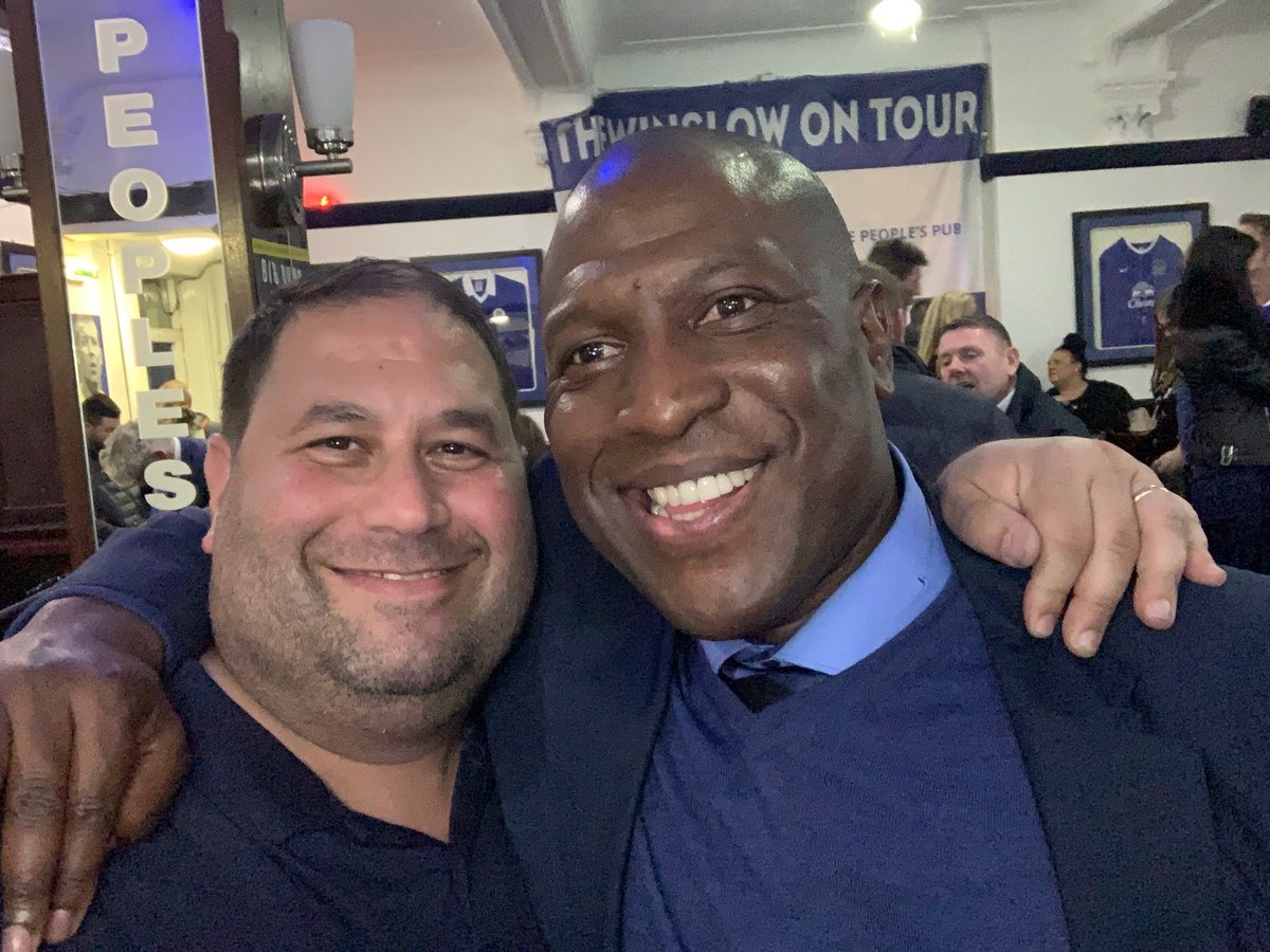 TheGoonersPod's tweet photo. VERY LONG tweet but I hope you'll take the time to read it. 

Kevin Joseph Campbell has passed away, at the cruelly young age of 54. While it is an inevitable fact that all people – whether family members, friends, strangers, sporting or show business idols, everyone – eventually meet this fate, this is the hardest to grasp, the most confusing to make sense of, as to why something so awful could happen to someone so purely and completely wonderful. While I cannot stop from happening what has happened, none of us can – I would like to share with you some of the multitude of reasons why “Super” Kev was “Super” – and the absolute best of all of us. The fact that so many people reading this will already have known why Kevin was “Super” is testament to the man’s greatness.

I first laid eyes on Kevin Campbell in text form. It was 1988 and I, as a 15 year old American finding myself in London for two years as my stepfather’s job brought us there, somehow ended up regularly on the North Bank Terraces of Highbury, 90 minutes before kickoff (to make sure to get my spot) armed with a pint of scotch, a diet coke to chase it with, and an Arsenal game programme to help pass the time. It was in that game programme that I would see Kevin’s name – in the “Reserves and Youth” section. I noticed that he was virtually always listed amongst the scorers and heroes of the squad, to the point where it became a regular tradition for me to open the programme and go directly to that page to see how many goals Kevin had scored since the last programme was out. He became this mythical creature, this young man who clearly was becoming too good for that level, but would face stiff competition from Smith, Merson, Marwood, Groves in the senior team’s attacking force. I wondered when I would see him on the pitch at Highbury, and whether his youth form would replicate on the biggest of stages.

What I didn’t know at the time was that he was very much on the fringes – spending time and travelling with the first team before (and after) going to Leyton Orient on a loan spell where his form in front of goal (9 in 16 games) made him a hero and carried that team to promotion to the third tier. Thankfully, George Graham rebuffed Orient’s understandable attempts to sign him permanently – he was far too good for third tier. Kevin made it back to Arsenal from loan in time to be with the club for its crowning moment – 26 May 1989 at Anfield.

Fast forward to 7 March 1990, a home match against Nottingham Forest. After returning from a half-season loan to Leicester City, Kevin was (finally!) brought off the bench as a second half sub, replacing Merse. It doesn’t take a genius to figure out that Kev put the ball in the back of the North Bank net that day – finishing off a 3-0 win. I will never forget that moment – even 34 years later – because it was so anticipated to see him and he delivered, taking a nifty flick from Smudge, driving towards goal and cooly finishing to the far post. Who was the first person he celebrated with? A high-five to the steward standing on the west side of the North Bank. This was not an inconsequential moment, as it may have been the first of many times that Kevin, now a senior professional superstar, would share special moments with “ordinary” people.

Kevin’s footballing career took him to some amazing places – holding FA Youth Cup, First Division, FA Cup, League Cup, and European Trophies in his time in North London, moving to Nottingham Forest where he played a major part in their promotion to the Premier League in 1998, then to Turkey for a brief spell with Trabzonspor where he ultimately left the club in protest over his teammates not being paid (as well as some other unpleasantness with club leadership). Eventually he arrived at Everton in March of 1999, where he immediately (and virtually singlehandedly) kept Everton from relegation by scoring goals in bunches from the off and eventually became Everton Football Club’s first black captain. His final stops were West Brom (where once again he helped save the club from relegation with his goals) and Cardiff City, where his brilliant 20 year senior career came to an end.

So that’s Kevin Campbell the footballer –a prolific footballer with a knack for scoring massive goals at vital times, assisting in the winning of trophies, the avoidance of relegation, and promotions for virtually every team he was part of. But even more – a beloved teammate, a leader, a virtuous man who soaked up every bit of deserved adulation and praise from those who supported the clubs for which he played. 
 If that were the extent to which I knew Kevin Campbell, I would be very sad today over the loss of a great footballer. Sadly today, but truly fortunately, that is not the extent to which I (and so, so many people) knew Kevin Campbell.
Fast forward again to 11 March, 2018. It is a day that I have long called my favourite day as a Gooner despite it not lining up with any massive footballing outcomes. I once again found myself in North London, visiting and taking in my beloved Arsenal against Watford. The day began in a pub sharing drinks, stories, and laughs with a friend and another truly great (and sadly departed) man, David Faber aka “Goonerholic.” It was always wonderful to start these days connecting with a bridge to Arsenal’s past, and I valued those conversations greatly. From there it was off to the game to meet up with more of the great new friends I’d made in recent years. Would you even believe that in this 3-0 win, we saw the absolute rarest of footballing feats – a Petr Cech penalty save against Troy Deeney!

On a high from watching a pleasurable Arsenal performance, we flocked to the Twelve Pins for our usual postgame drinks and to revel in our victory. One of our friends, Lee, was missing – but I got a text from him that he had a surprise for us. 5 minutes later, out of the corner of my eye, I see Lee bouncing towards the pub with a special friend in tow – none other than Super Kevin Campbell. By that time, I had been lucky enough to have Kevin as a guest on our podcast, but never envisioned I’d ever have the opportunity to meet him in person. Dressed impeccably (as always), wearing a red shirt with black jacket and black cap, he rolled into the outdoor patio of the pub and immediately started singing Arsenal chants with the dozen or so of us who were gleefully jumping up and down with him.

Kevin took time to personally greet everyone, shook hands, gave out hugs, bought pints and accepted pints bought for him, and just “hung” with us for hours. It wasn’t an “appearance” or a token gesture, he was truly being a fan, a fellow supporter gleeful at our win on the day, an equal, a Gooner. I of course was giddy and the full circle of it all, exactly 28 years to the week that I watched him score his first goal for The Arsenal. We facetimed my mate Andy who was in Colorado to wish him a happy birthday and taunt him for missing out on this epic event. The evening got fuzzy after a while, but I woke up the next morning (on my 45th birthday) with a smile on my face from a truly epic evening meeting one of the heroes of my Arsenal youth and celebrating together like mates.

Those scenes would be repeated several times over the following 6 years. At pubs before and after Arsenal games on occasion. On podcasts where he occasionally joined us to have a nice chat. In Manchester whenever I happened to be there, taking time to sit with us (and buy us drinks, he never let me buy) at his favourite local pub, O’Shea’s Irish Bar on Princess Street. It was there that Kevin met my son Jake for the first time, and on a separate trip my wife Stephanie. He was truly a friend, someone I didn’t feel like I was “bothering” when asking for his time, his company, or a favour that was something only he could do (like recording special messages for birthdays and other special events for people I cared about and therefore he cared about).

Yes, it’s a well known “truism” that you should “never meet your heroes” but Super Kevin Campbell stood that theory on its head. I found myself forgetting (briefly) at times Kevin the footballer and just enjoying this man, this new friend I had made, one of many friends I’ve made as a result of loving this football club together.

And that’s the thing - you didn't even have to know him well to know who he was and what he meant. His outstanding football career was the springboard into our consciousness. But only the springboard. Who he was as a person, how he conducted himself, the experiences and philosophies that he shared with anyone that would take the time to listen, has forever changed what athletes and "celebrities" have the capacity to be to even the most "distant" of admirers.

I’d love to share a few more personal stories of my all-too-brief friendship with Super Kev. 
 In October 2018, a few months on from first meeting Kev in person in London, I was back visiting England from the US and my mate Tom and I jumped on a train to go see Everton host Crystal Palace – our first trip to Goodison Park. As we approached the “FanFest” area outside Goodison, I heard a familiar voice over the loudspeaker, only to look up on the “stage” to see Super Kevin Campbell, decked out in a dapper all-blue suit, being interviewed and co-hosting the pregame entertainment for the Toffee supporters gathered around. It felt strange, seeing Kevin in a non-Arsenal environment, but I was happy to see him. I wondered if he’d remember me from our meeting earlier in the year, especially with me not wearing Arsenal colours, but I took a chance and told my friend Tom “watch this” as I pushed my way up to the front of the crowd near the stage.

Tom and I still laugh about what happened next – Kevin glanced out onto the crowd while he was talking and saw me – instantly derailing his concentration. He had a look of “what is that guy doing in this setting” and for about 3-4 seconds, people must’ve wondered what was wrong with him because he completely lost his concentration before re-centering and picking up on his interview. A few minutes later, at the end of his duties, he came bounding off the stage, flying past Everton supporters who were waiting to greet him, and gave me a huge bearhug and a “what are you doing here?” laugh. In that moment, in that setting, I felt about 10 feet tall. Kev had a special way of making people feel, well, special and that moment is burned into my memory as a hilariousy funny and warm moment we shared together. After the game, we coordinated to meet up at the Winslow Hotel pub, right across the street from Goodison Park, and attempted to catch up and have a couple of pints together. I say “attempted” because Kevin was absolutely mobbed by Everton supporters.
It was at that moment that my general knowledge of his positive time at Everton was met with the realization that he was truly a club Legend with a capital “L.” Even though Tom and I didn’t get as much time with Kevin as we’d hoped, it was an absolute treat to be able to witness the way Kevin was being lauded and adored, as he took picture and after picture, signed shirts, lifted a glass, and had genuine conversations with every single person that approached him.

Kevin also created something hilarious for me that will live on with affection and pride. As we podcasted more often together, both on our channel and on his beloved Highbury Squad podcast that he co-hosted with his brilliant and dear friend Sophie Nicolaou. On one occasion a few years ago (I can’t remember exactly when) he just started handing out nicknames. Out of nowhere, and for seemingly no reason at all, to Super Kevin Campbell I became dubbed “Magic” Mike.

Now its important to me that people understand that I did not nickname myself Magic Mike – I neither look good shirtless, nor do I think I’m particularly magical – that’s the wonderful irony of the nickname. But where most nicknames are brief funny moments and don’t stick – this one stuck, because of who it came from. I’ve worn that nickname with pride, as a bit of a piss-take on myself, but mostly because it makes me smile and remember Kevin fondly. My favourite part of this, and the one I will miss the most, is how he never called me “Magic Mike” he just called me “Magic” as though that was my actual first name. He would interrupt me making a point by saying “But Magic, Magic, you have to realize….” or end a statement with “and its all part of the game, Magic.” I sometimes think he might’ve forgotten my name was even Mike and just renamed me altogether out of force of habit. I love him for that.

Speaking of people I love, my family are of course my pride and joy, for so many reasons but among which is their enthusiasm and fervour along with me for everything Arsenal. Kevin met every member of my family at least once. He shared a visit at O’Sheas with my wife and myself. He met my daughter before the final game of the 2022 season (against Everton, of course). But it was his visits with my son Jake, himself a youth footballer and a prolific scoring striker, that were the best. The three of us just talked about football, about the skills, but mostly about the psychology and approach to the game. As a tactically NONastute football viewer, I prefer dwelling on the intangibles, chemistry, mental aspect of competitive sport. Kevin understood that and I think preferred those discussions to tactical ones himself.

Jake and I found those conversations to be incredibly special, motivating, and appreciated. Jake, just the day before we lost Kevin, was proudly wearing his 2022 Arsenal shirt that Kevin had signed for him. Kevin was wonderful with my family, but the father he was to his own children even more special. I sadly have not personally (yet) gotten to know Kevin’s two wonderful sons, both footballers in their own right taking after their “Super” Dad. But I do know how much he loved them, supported them, and Tyrese’s social media tribute to his father is an absolutely beautiful while poignant reminder of what their father meant to them. Having lost my father at far too young of an age myself, I hope I can be of some comfort and friendship to his wonderful family at some point.

Another memory of Kevin being “Super” was the summer of 2021, in Orlando Florida, where both Arsenal and Everton were meant to be playing an exhibition series. At the last minute, Arsenal cancelled their trip due to a COVID outbreak, but Everton still came, as did a significant number of both Everton and Arsenal supporters. One day, we had a Gooner party and fundraiser for Gooners v. Cancer that coincided with the pregame for the Everton game, and a table of Everton-clad supporters were sitting in the pub near us. I walked up, struck up a conversation, and it eventually turned to Kevin Campbell, our shared hero. They spoke effusively about how much he meant to them, and I mentioned that he was a friend, which they promptly mocked me for, accusing me of making it up. So of course, I hit a few buttons on my phone and within seconds, the table was passing around my phone to talk to Kevin via Facetime who was all too happy to take time out of whatever he was doing that day to talk to his adoring Everton fans. We made some friends that day, and I’m pretty sure we made their day.

Kevin was, what so many “famous” people struggle to be, so generous with the most valuable resource that any of us on this earth have – their time. Kevin made time for so many people, which I suppose was made a bit easier by the fact that the man seemingly never slept. If you followed Kevin on social media, you know what I’m talking about – until he became ill there was one thing you could rely on to make you smile every day – a 4am (UK) tweet wishing everyone a message full of inspiration in the inimitable Kevin style. Wishing us a Super Sunday, a Happy Monday, a Terrific Tuesday, a Wonderful Wednesday, a Funky Friday, and of course, his famous “Dickie Bow Thursday” where he would always wear a bowtie aka “Dickie Bow” in honour of a dear friend of his from many years ago. Living on the East coast of the US, I saw these messages at 11pm just before bed and it always sent me to sleep with a smile on my face.

Kevin also gave generously of his time for so many good causes – anything from a video or voice note for a friend of a friend who was celebrating or mourning something, to joining in and sharing his time and wisdom on a wide variety of Arsenal podcasts including Highbury Squad and many others – he loved the podcasting medium because it allowed him to connect with so many great people at the same time and interactively communicate with them. He helped to create a true community and family of podcast viewers who eagerly interacted with him, respected him, bantered with him, learned from him, and shared special moments with him. He was a rare person today who could have a spirited discussion, even disagreement, with someone and never cross the line of taking offense or having hard feelings. Every debate would end with a smile and loving words, and a greater message of peace and love for the community at large.

And of course, Kevin always stepped up when it came to charitable causes. Kevin was among the first, and the most consistent, to give anything necessary – time, promotion, signed shirts, support, etc – to my charity Gooners v. Cancer and to so many other valuable charitable efforts. I’ve not met anyone with the ability Kevin had to do so much, for so many, yet never seem overwhelmed, stressed out, or burdened.

In an age where sport and the celebrity culture have evolved and changed so much from what it used to be, into an often distant, sometimes combative relationship between “fans” and “idols,” it is a truly rare pleasure to see a man so universally loved by everyone, from so many corners of the footballing world, the media world (did I forget to mention that Kevin was an active pundit and studio panelist for many broadcasters around the world?), and beyond. Not a single person has anything negative to say about the man, and I’ve never quite seen such an outpouring of grief, mourning, and tribute for a footballer we have lost (since perhaps David Rocastle) where the tributes are about the man he was far more than the footballer he was, and he was an excellent footballer.

We have, devastatingly, lost a quiet giant. A man who wasn’t outspoken, wasn’t flashy or wanting of attention but was relentlessly kind, selfless, available, accessible, sweet, warm, funny, astute, and most of all, loving. The Arsenal Family (and other teams and football as a whole) have lost one of the rarest of men, who should be emulated in their capacity to bring joy to so many and truly serve as a connecting force between the top of the game (the top talent playing the game) to the absolute roots and lifeblood of the game (the supporters like you and me). As the Beatles famously said:
 
 Three statements sum up my feelings for Kevin. First, the Beatle’s final words: “And in the end, the love you take is equal to the love you make.” Never has this been more true than with Kevin.

Second, Kevin’s own very wise words of advice. He ended every public appearance, podcast, and conversation with “Be sure to tell your loved ones that you love them… because you never know.” Truer words have never been spoken and I am forever grateful that I was able to tell him I loved him.

And finally - it can only be one thing. I hope you are well and truly now At Ease, Kevin. At Ease.