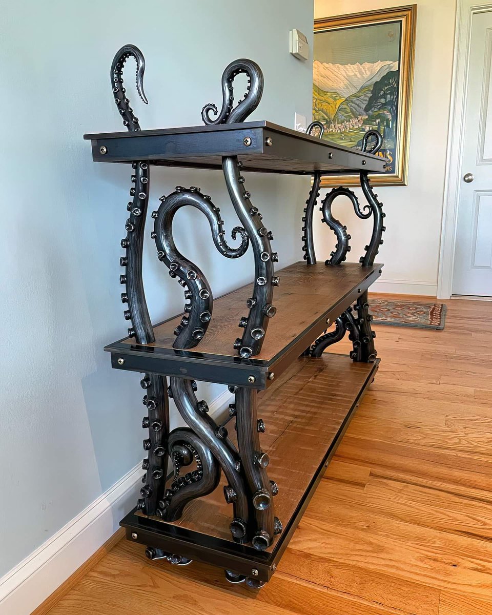 Steampunk_T's tweet photo. Kraken Book Case by Metal Artist Karl Saar (KustomSteel) https://t.co/EpWp4pGFp2