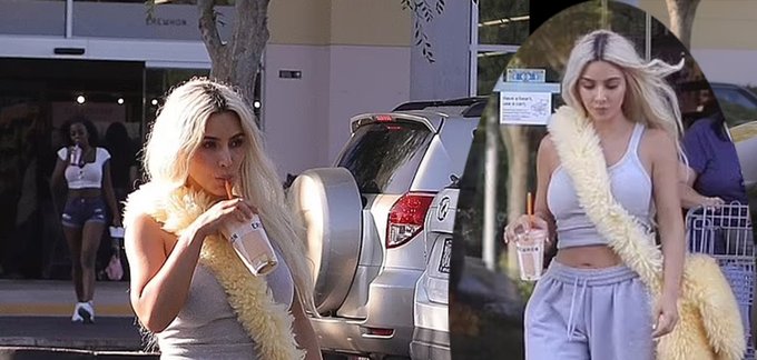 Kim Kardashian Flaunts Her Curves in a Grey Tracksuit and Fluffy Maxi Bag While Grabbing a Smoothie in Calabasas
