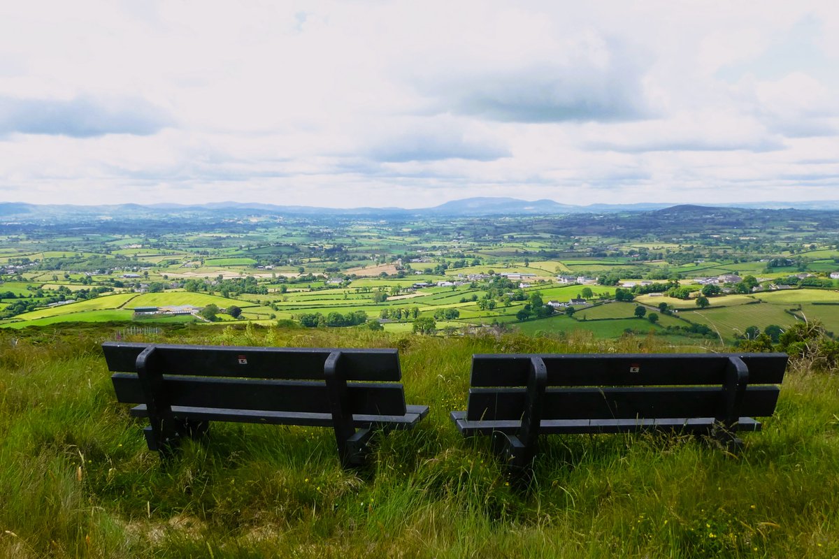 The view from the slopes of Dechomet Mountain, #countydown #northernireland, looking out over the Down countryside with Slieve Gullion and Camlough Mountain #countyarmagh on the horizon. Definitely two of my favourite benches.