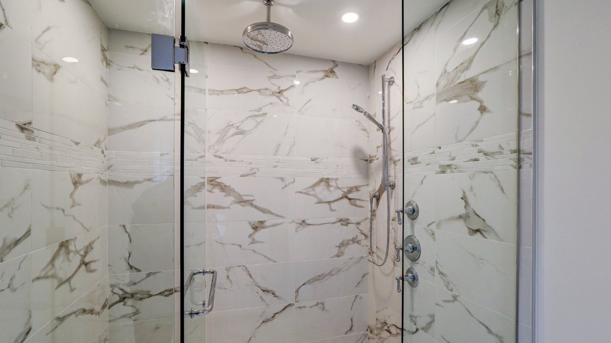 Step into luxury with our custom bathroom at Fred Varley, showcasing the exquisite marble floor that elevates the space to new heights of sophistication.  Contact RS Homes at 416-480-0282 or visit our website at rshomes.ca