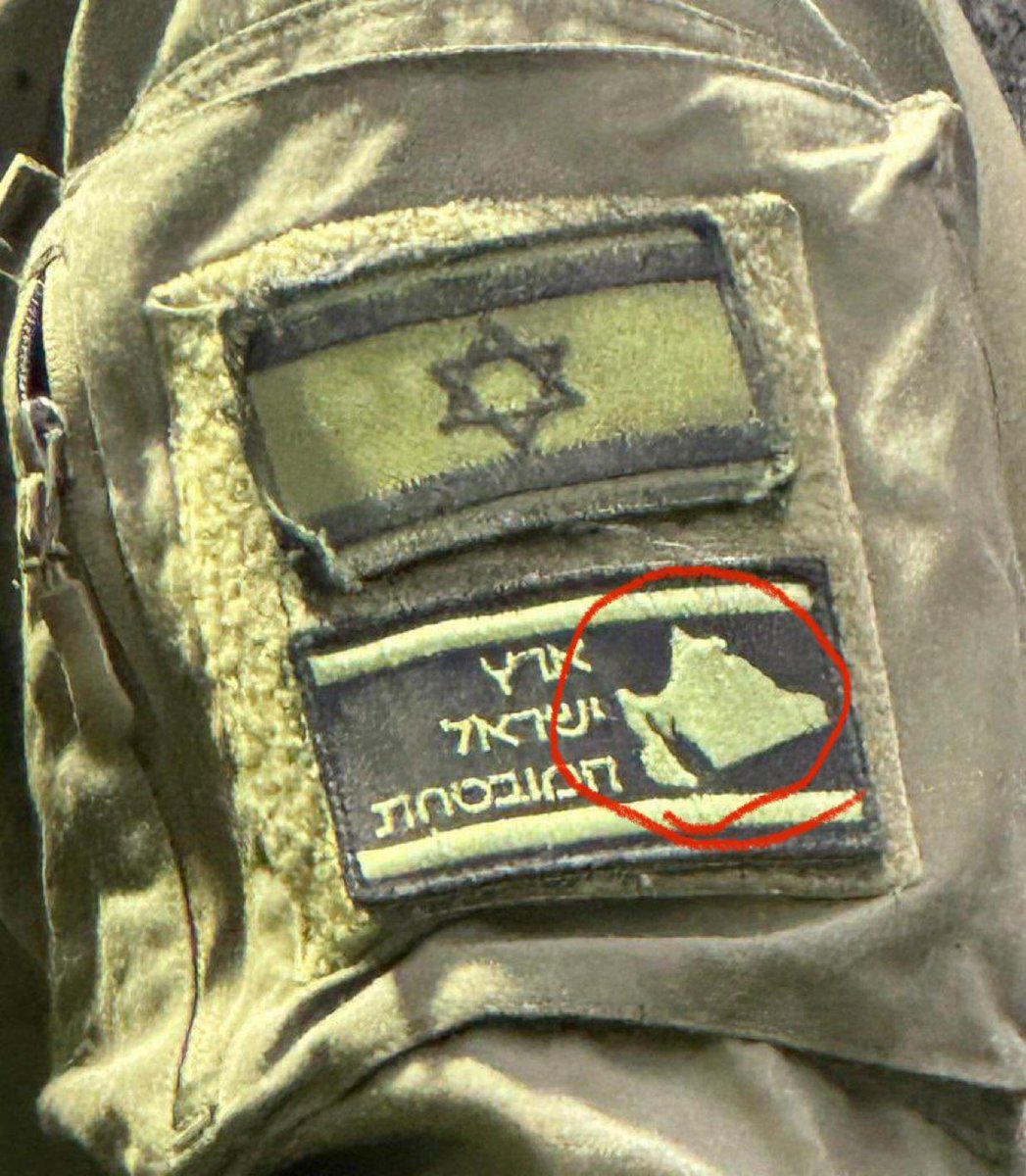 DrLoupis's tweet image. Israeli soldiers stick a badge on their uniform showing a map of Greater Israel, which includes parts of Egypt, Saudi Arabia, Iraq, Syria and Lebanon! 

Truly diabolic. 

@AbujomaaGaza