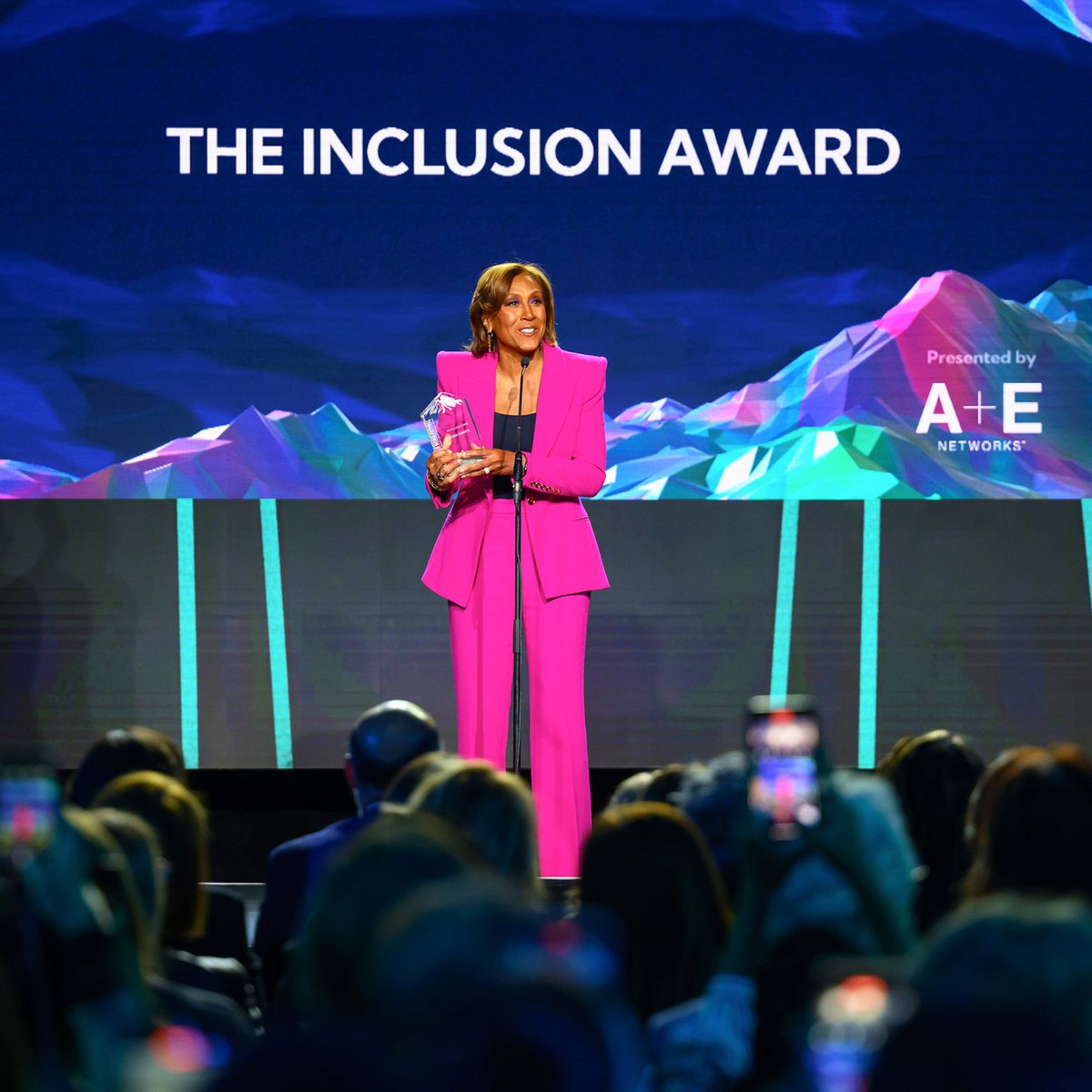 AE_GlobalMedia's tweet photo. "Diversity is being on the team, inclusion is getting in the game. I'm so grateful to A+E to allow me to be in the game, with you," said @RobinRoberts upon accepting the Inclusion Award at the 2024 @BanffMedia Festival's Rockie Awards gala, sponsored by A+E Networks. https://t.co/RYqLHQUYIf