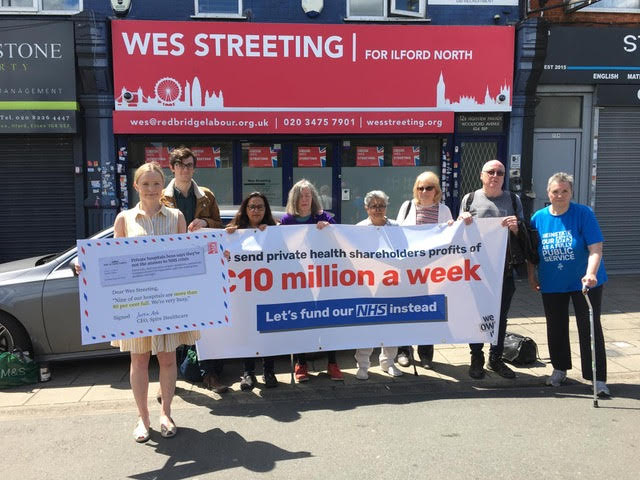 CatHobbs's tweet photo. Today we visited shadow health sec Wes Streeting's office in Ilford North to send a message:

Our new research shows £10 million/week is wasted on private profits instead of invested in OUR NHS https://t.co/9Bajr0tRt0

Labour could insource *94% of private contracts* by July 2029 https://t.co/iS4MTVtCAA