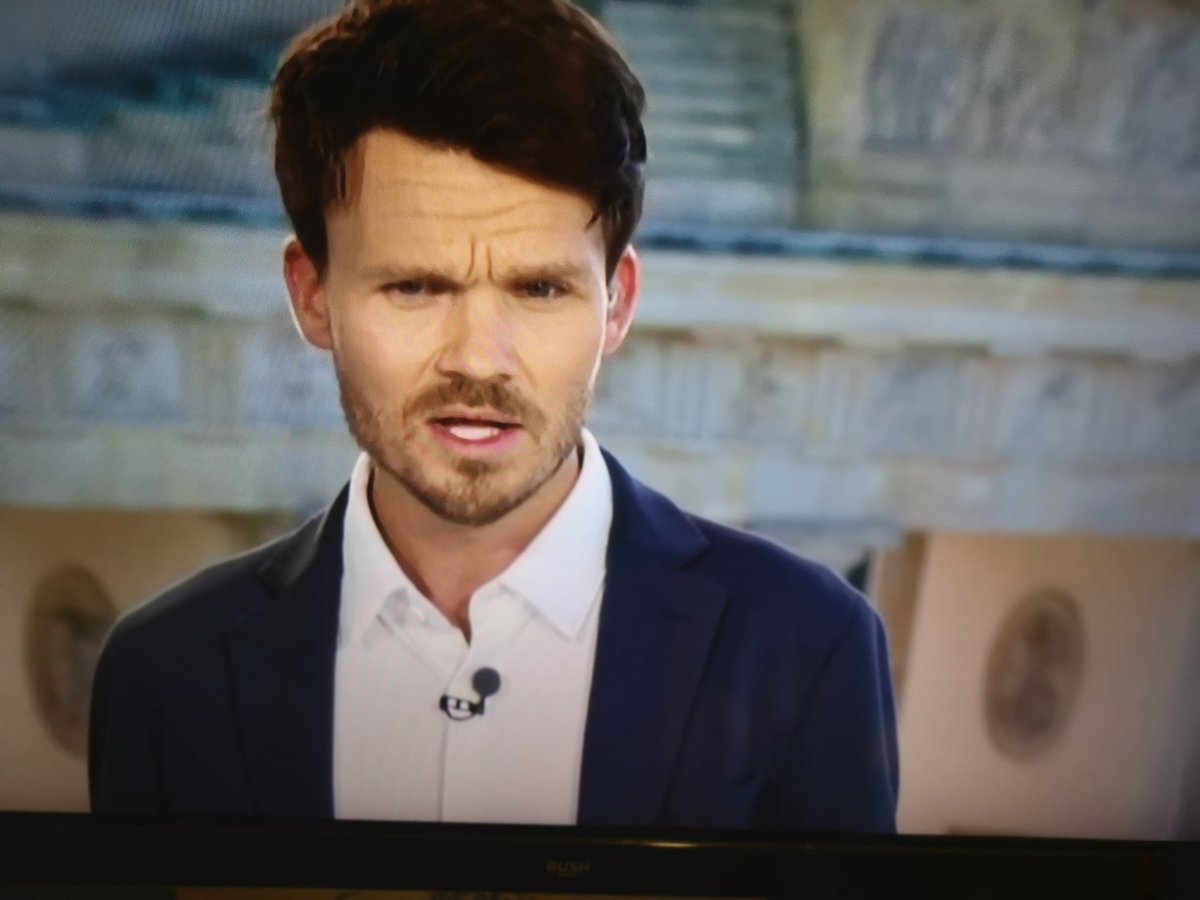 Sheffield Wednesday manager Daniel Röhl wearing a blue suit jacket and white shirt while being a pundit during ITV's Euro 2024 coverage of Belgium and Slovakia.