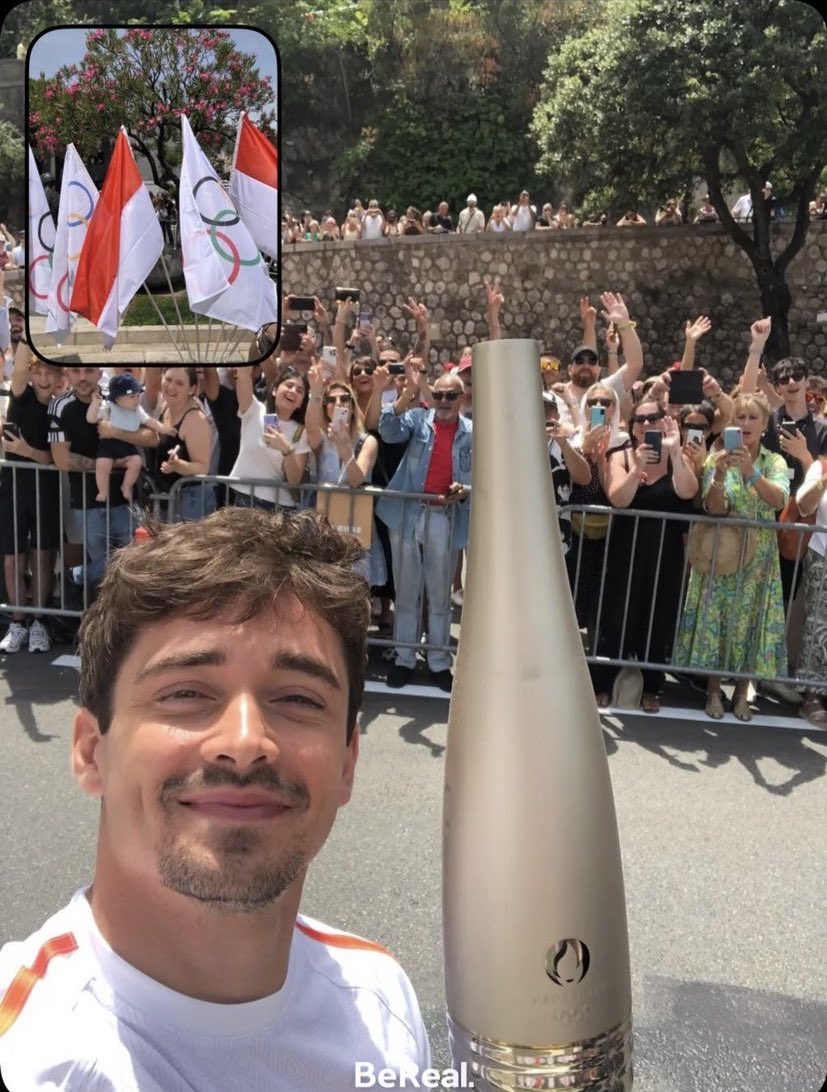 Charles Leclerc with the Olympic Torch