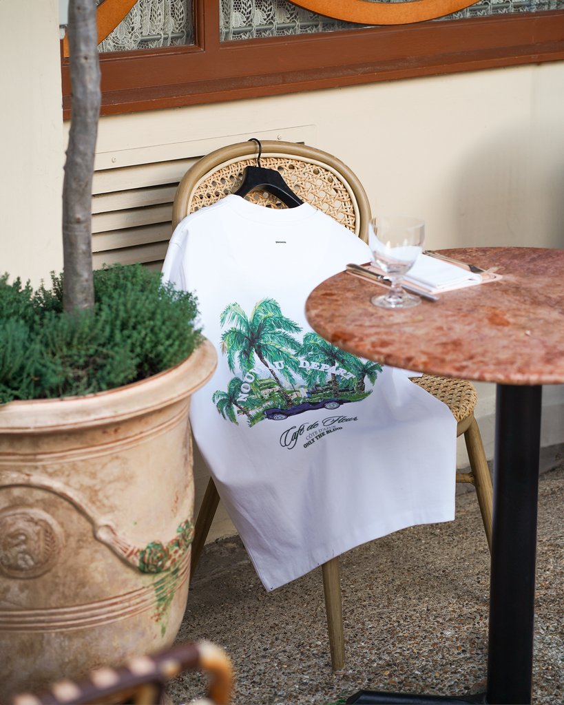 OnlyTheBlind's tweet photo. We took our best-selling Café de Fleur T-Shirt and reimagined it. Now with updated artwork and 3D embroidered details; this striking design continues to showcase a fusion of speed, elegance and sophistication 🌴 https://t.co/9r3QpWSUby