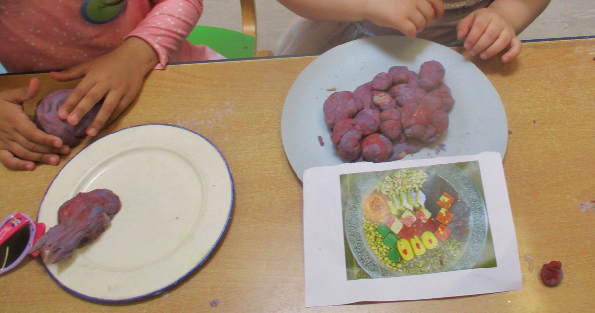 Thank you to families who have been coming in to talk to us about how Eid celebrations. 
A child said, "Eid, I get present, a Paw Patrol present. I eat cake, moon and star. Eid cake."
Children had fun making cakes and sweets too from playdough.