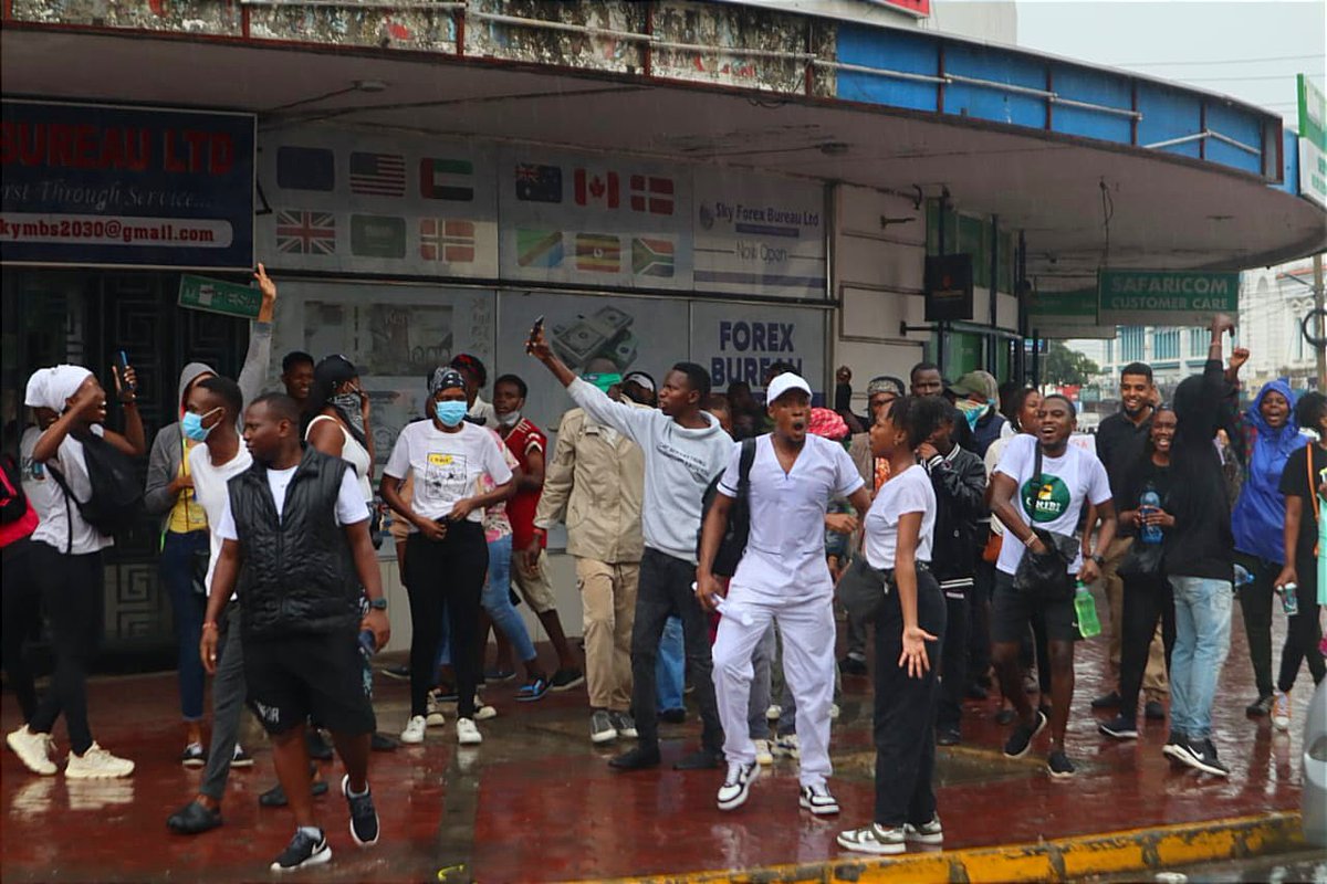 AjendaKenya's tweet photo. Undeterred by the rain, the youth of Mombasa persist in their demonstrations at the County Assembly, vehemently opposing the finance bill. These nationwide protests, underscore a significant collective dissent, with the hashtag #OccupyMombasa trending on Twitter. https://t.co/bhKIYIkN0s