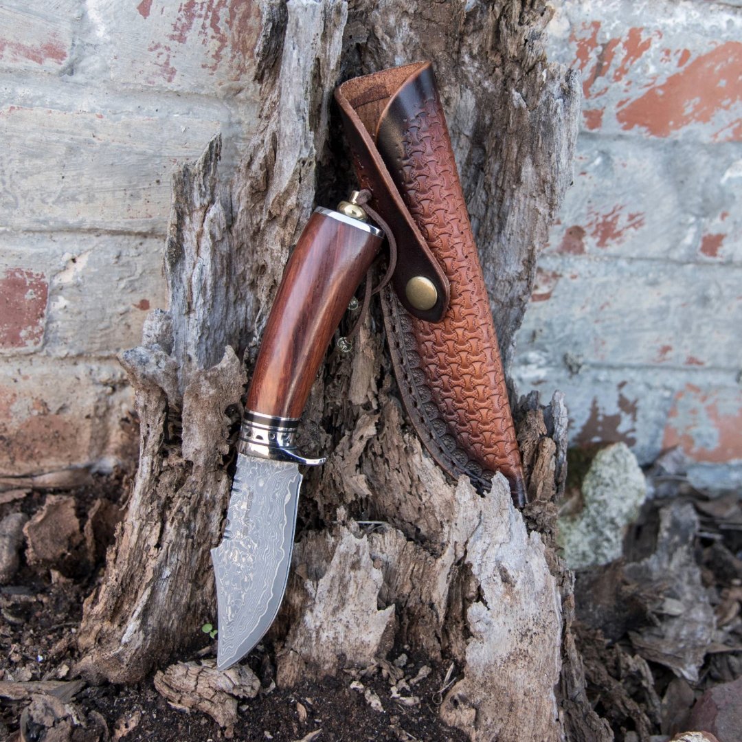 sargeknives's tweet photo. The Tribe Damascus knife sets itself apart from the rest. It features an 8" blade of damascus steel, a rounded rosewood handle, and a polished finger guard.  Keep it safe in it's matching leather sheath, and you'll be ready for anything! https://t.co/XTp7U6G5Vd