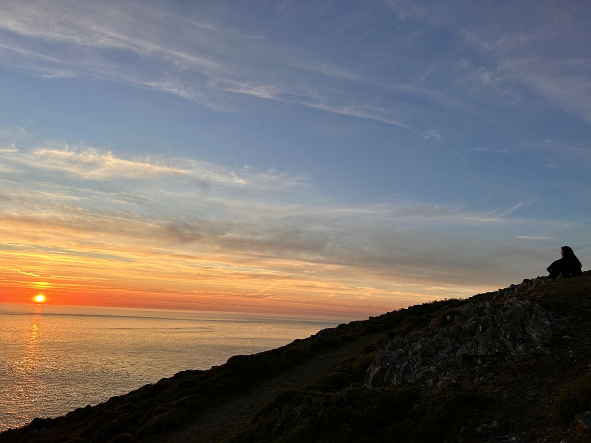 Dusk. 13°C. A few sheep and a couple of us watching the sunset.
