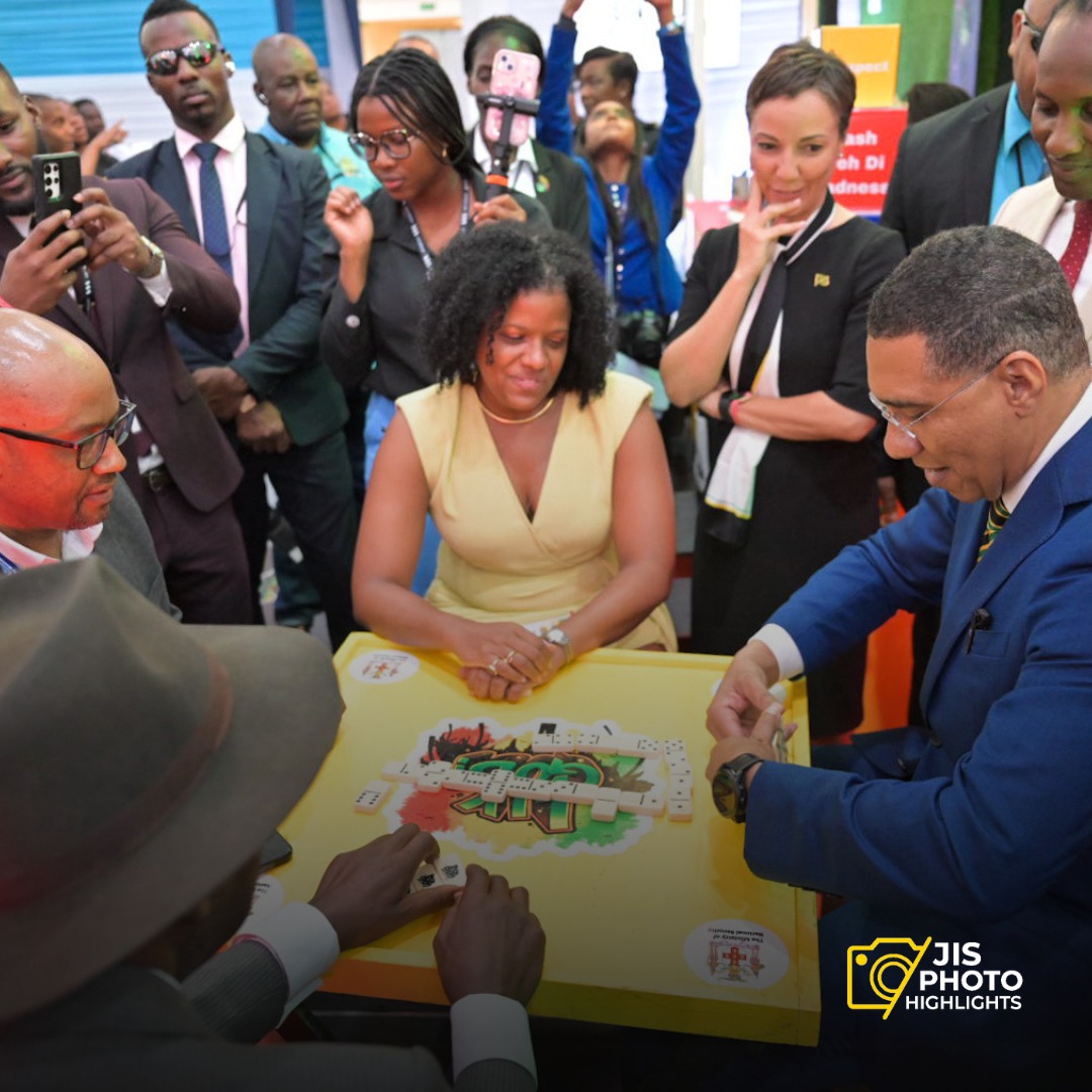Dominoes with the PM: because even leaders enjoy a good game. 

Prime Minister, the Most. Hon. Andrew Holness (second right), plays a game of domino while Minister of State in the Ministry of Foreign Affairs and Foreign Trade, Hon. Alando Terrelonge (right); Minister of Foreign