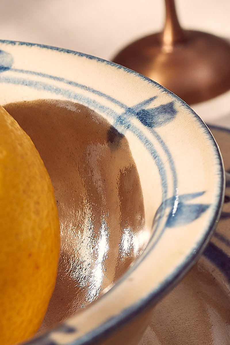 Summer table vibes with <a href="/RowenandWren/">Rowen and Wren</a>. Warm light breezes in through a sash window, flooding the table with heat and shadows. Cut fruit glistens, freshwater sparkles. #stilllife #stilllifephotography