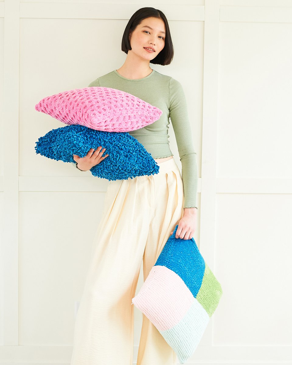 Chenille is fab for blankets and cushions so that's where we starting our look at the patterns for our new Squeeze Me yarn.
You can find the crochet blankets on patterns 10078 and 10079, and the knitted cushions on 10085. They're all so cuddlable.