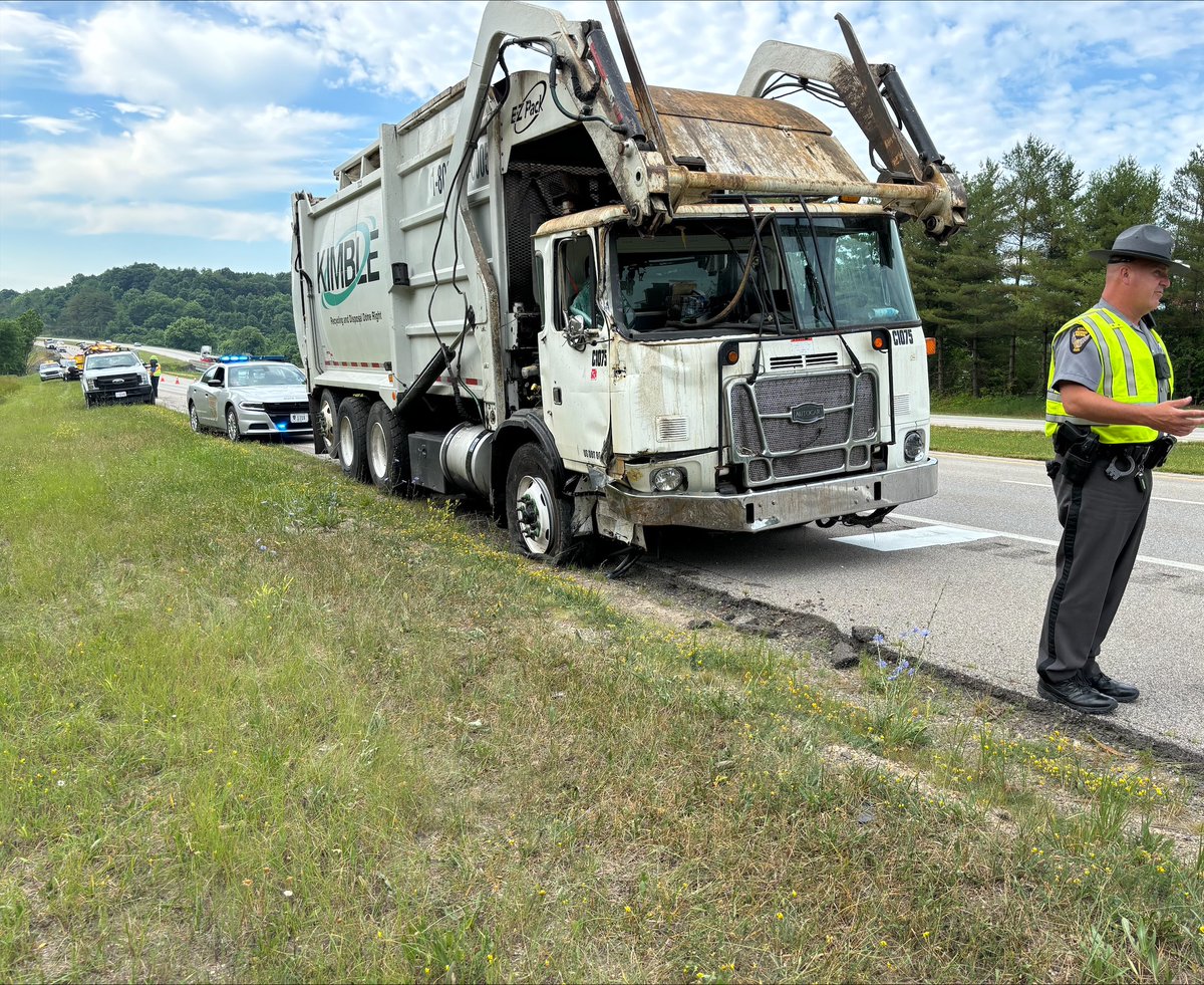 ODOT_SEOhio's tweet photo. A trash truck operator was cited with a marked lanes violation after striking our arrow board on I-77 in Noble County this morning. At the time of the crash, our employees were towing the sign with a truck, so our truck was also damaged. Move over and slow down! https://t.co/hqRRqFanTn