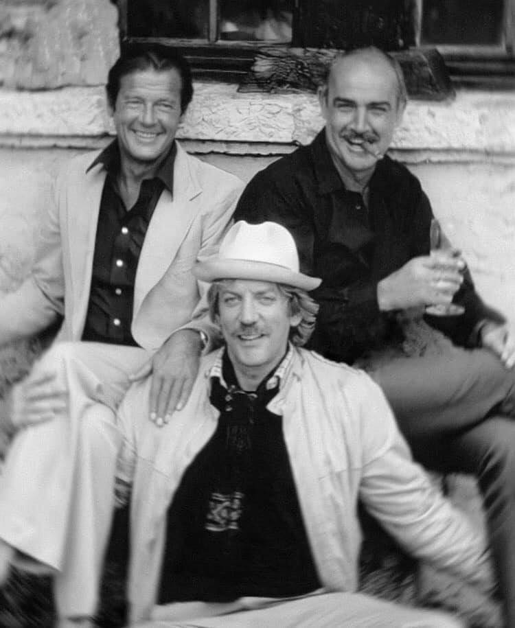 RIP Donald Sutherland - pictured here with Roger Moore and Sean Connery in 1983. James Bond would pay homage to one of his most famous films, Don't Look Now, in 2006's Casino Royale with 007 chasing Vesper in a red dress through Venice.