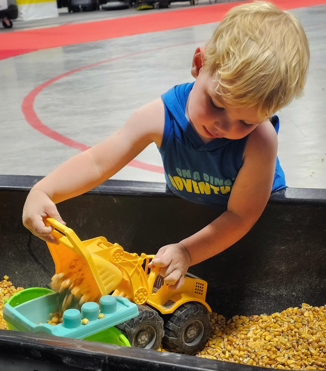 Two-year-old Hank Altena enjoyed spending some time playing in the corn box after touring the farm show. He attended the 51st edition of the Ontario Pork Congress with his parents Rik and Cherlyn Altena, who own Mapleton Pork Farm. 

📸: Sharon Grose