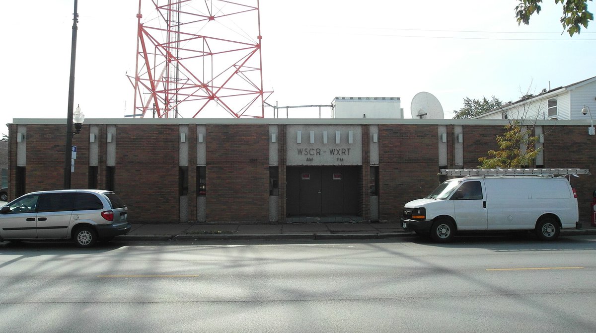 12th April 1981. WXRT Radio Station, 4949 West Belmont Ave, Chicago. Adam Clayton and Steve Lillywhite were interviewed ahead of U2's gig at Chicago's Park West venue that night. The station moved from this site in 2008.  Photo Adrian Boot, interview: u2interview.com/2007/07/04/ada… #U2